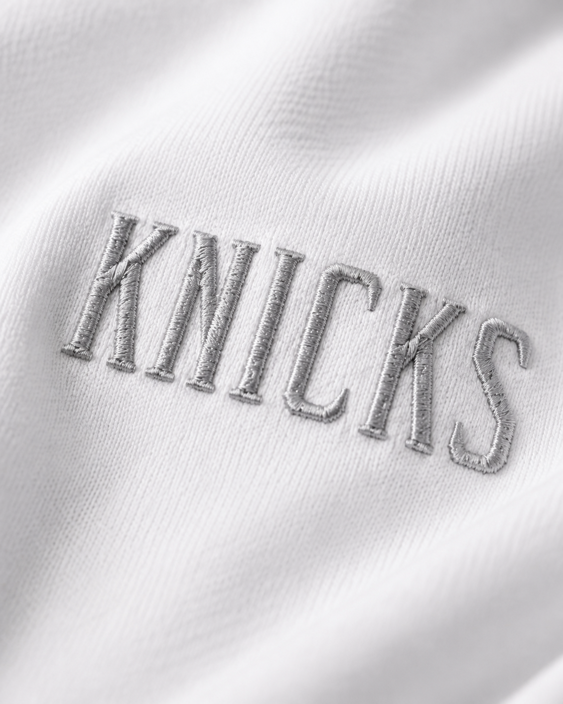 Knicks Embroidered White Lettering Hoodie White Embroidered Closeup.png