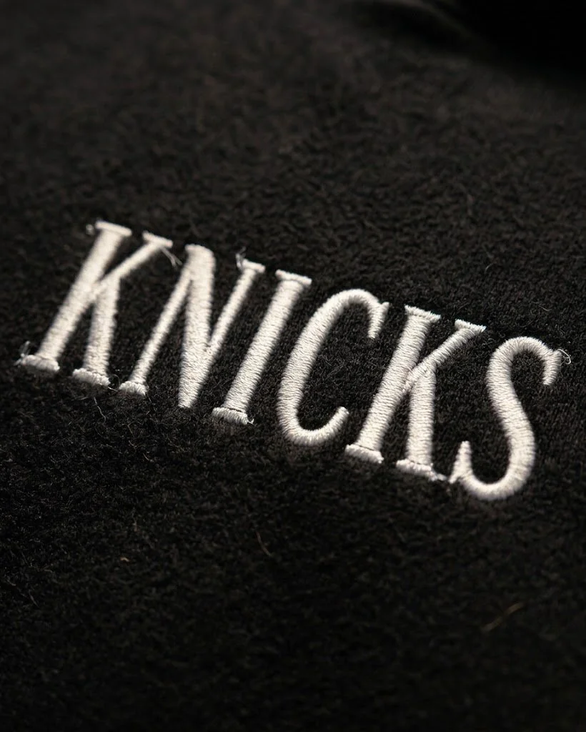 Knicks Embroidered White Lettering Hoodie White Embroidered Closeup on Black.jpeg