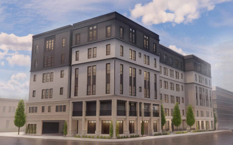 Modern multi-story residential or commercial building with multiple windows, trees along the sidewalk, and a cloudy sky.
