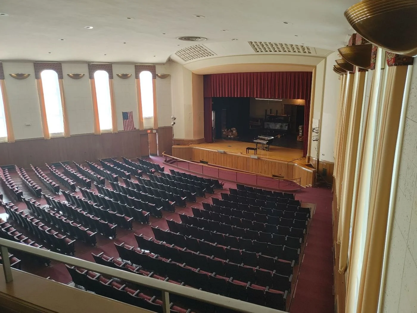 Auditorium inside a former school building being evaluated for adaptive reuse.