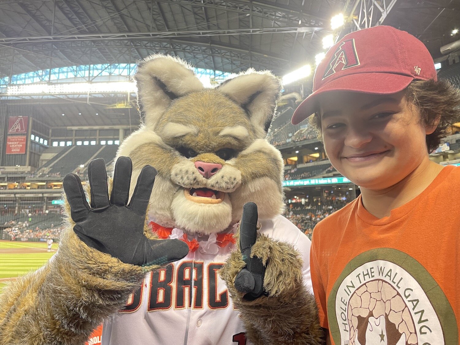 Baxter, the Diamondbacks mascot, congratulates Ollie on his visit to the 6th stadium on his MLB stadium tour