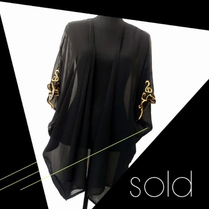 Imagine lushing around in a decadent post modern apartment sipping fancy cocktails and eating cheap takeout while wearing this and little (or nothing) else. FABULOUS!!!! 

An ultra rare cocoon fit robe with metallic embroidery. Easily one of the best