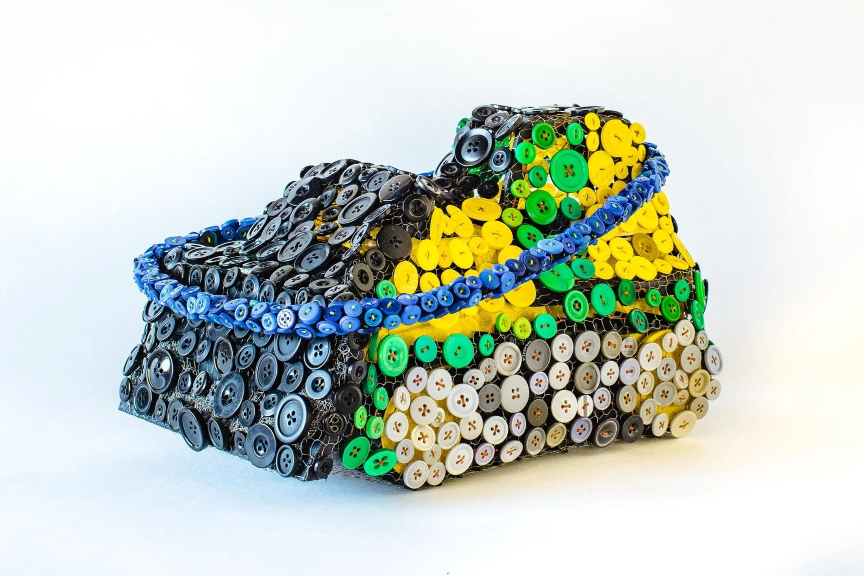 “Opposites Attract-Blue Halo” 
8 x 4 x 10in, Tonka toy, organza, buttons, 2021