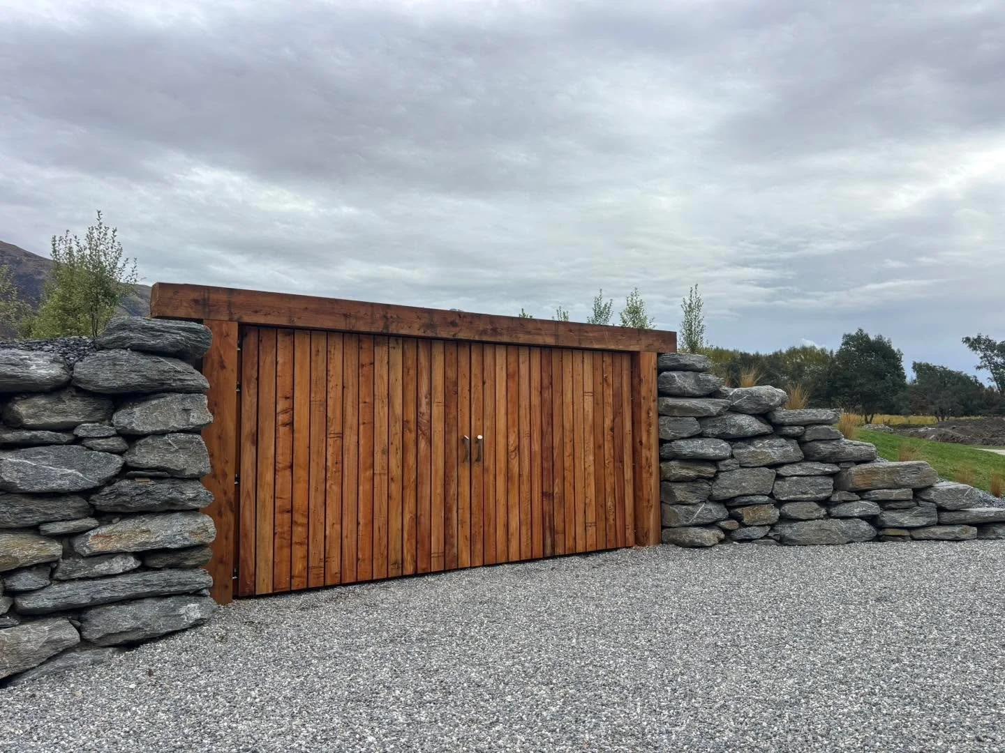 Not every project needs to be a full new build.

This custom feature was designed to completely conceal two shipping containers while adding to the overall landscape of the property &mdash; practical, tidy, and built to last.

At Tom Cooney Construct