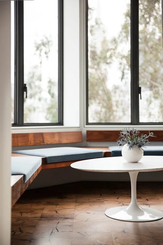 Custom kitchen with built-in nook seating in a San Francisco residence