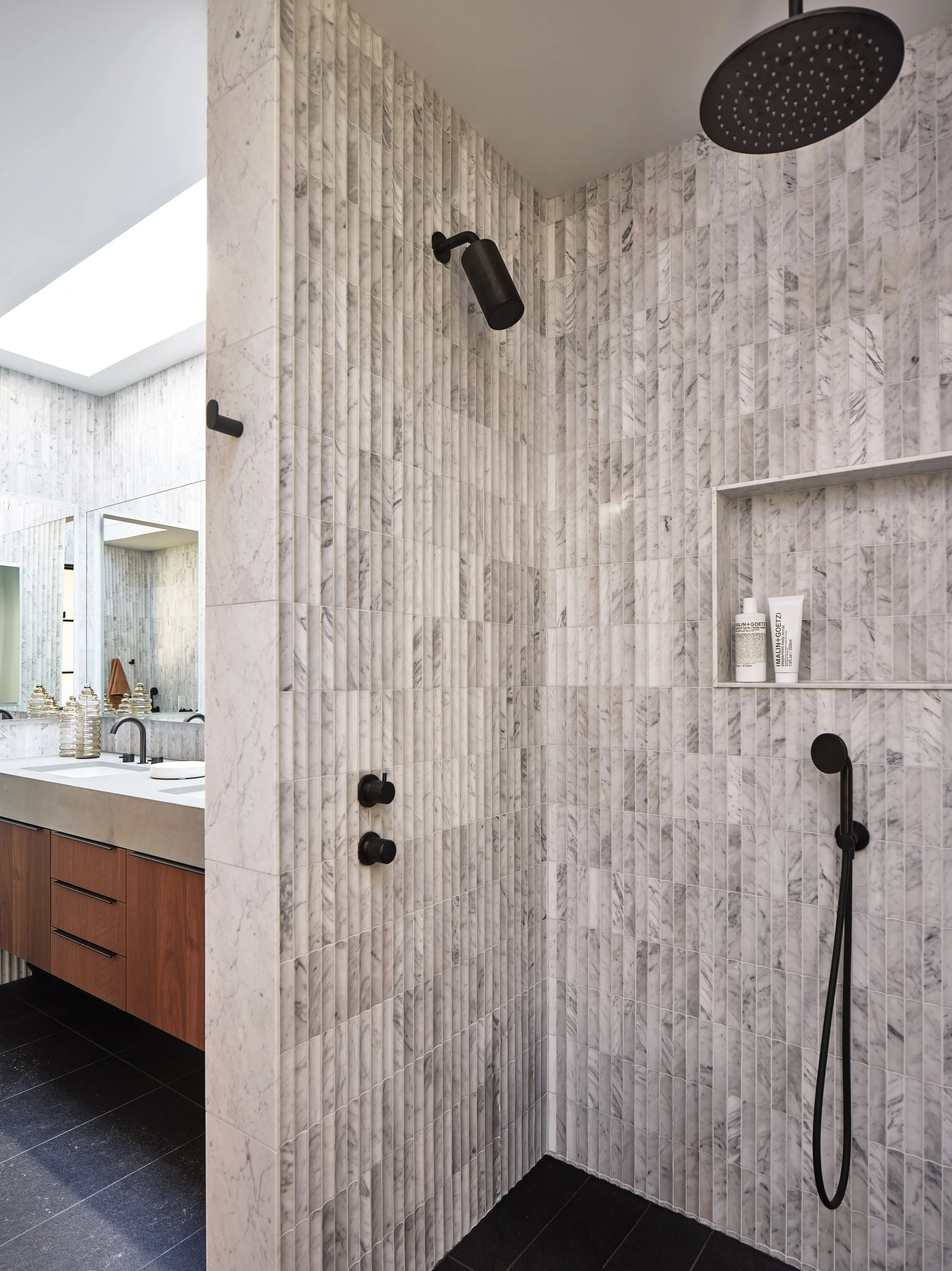 Custom tiled shower with warm neutral finishes