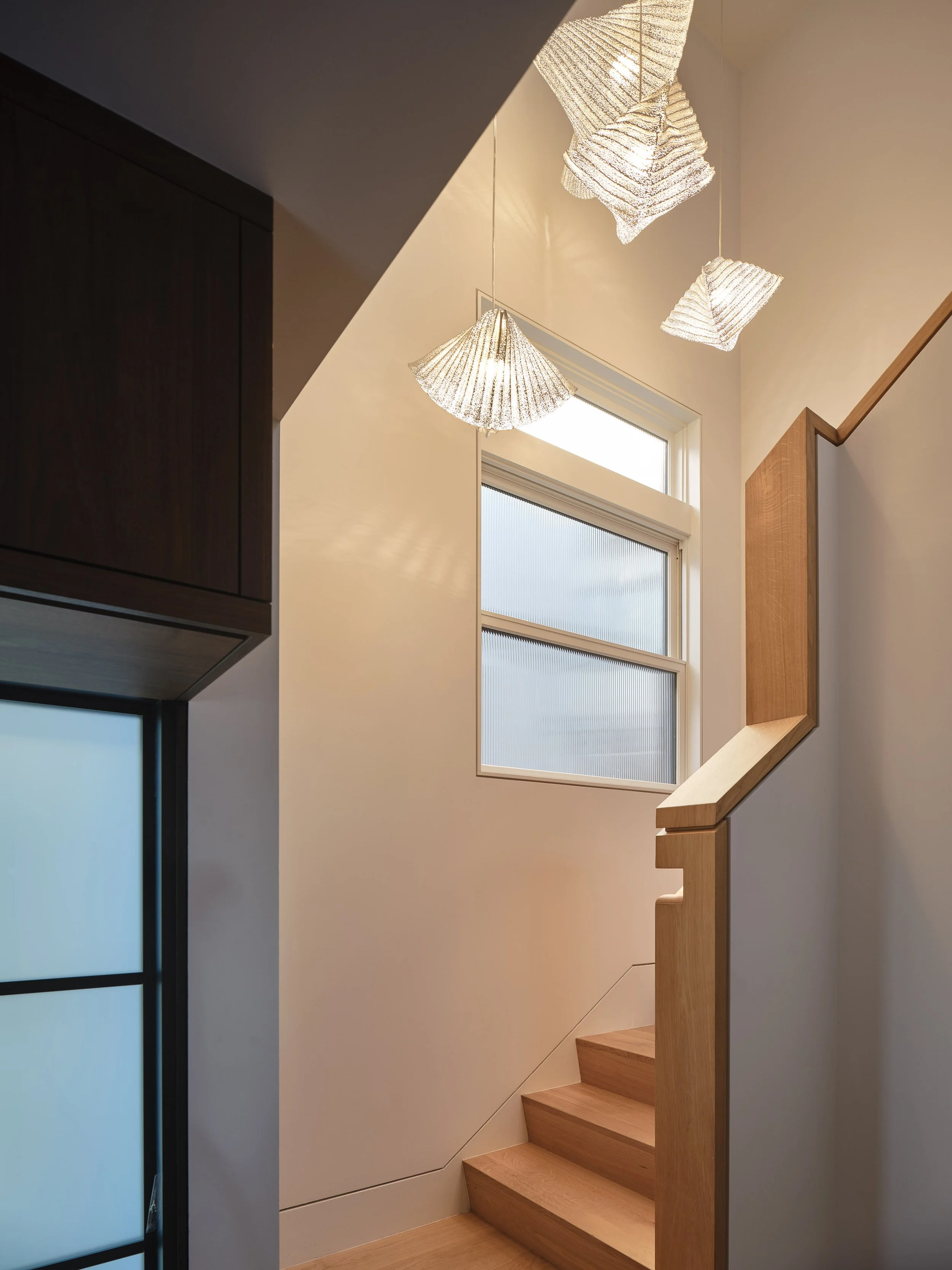 Sculptural wood staircase in renovated Oakland home 