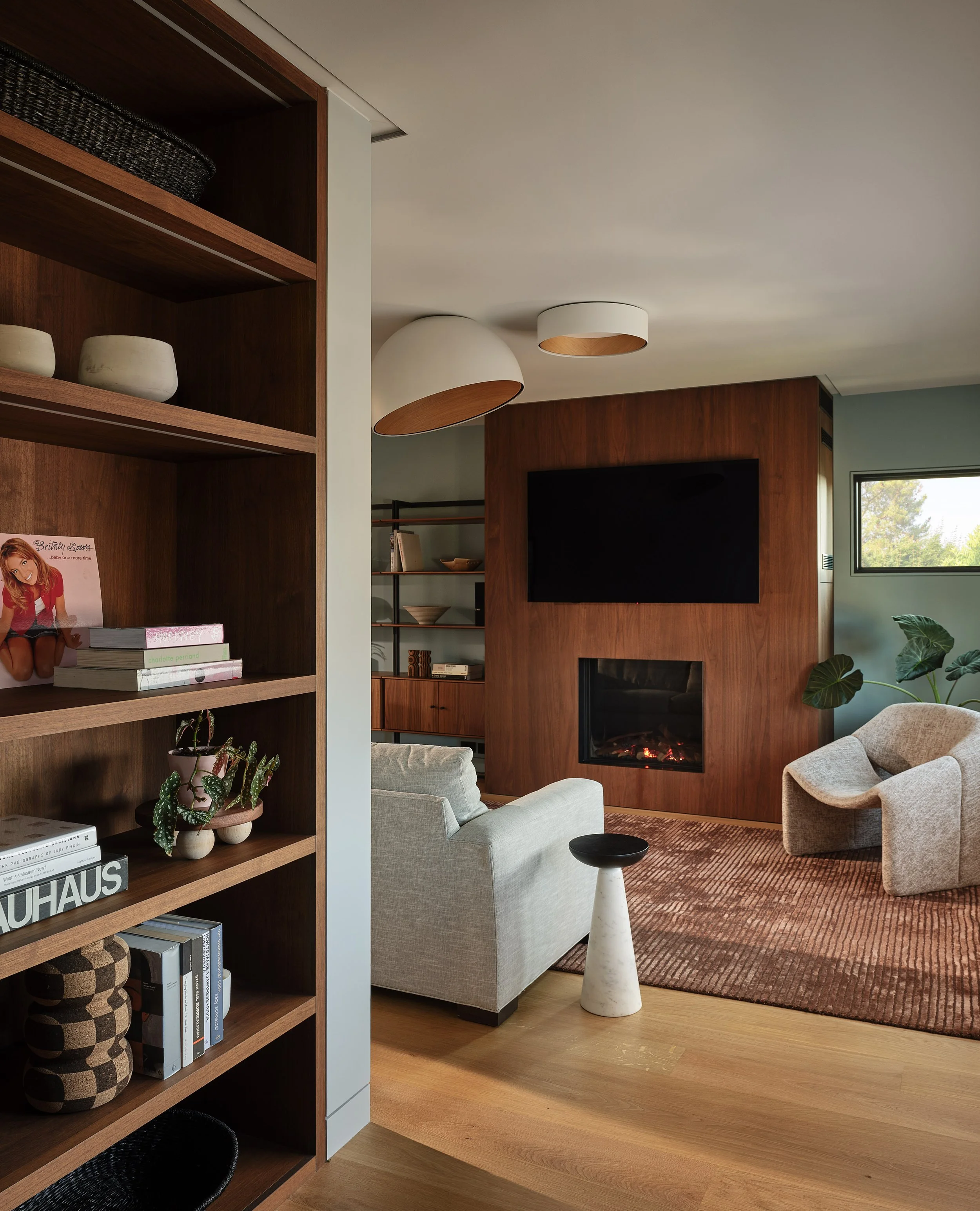 Warm modern living room with wood finishes and natural light