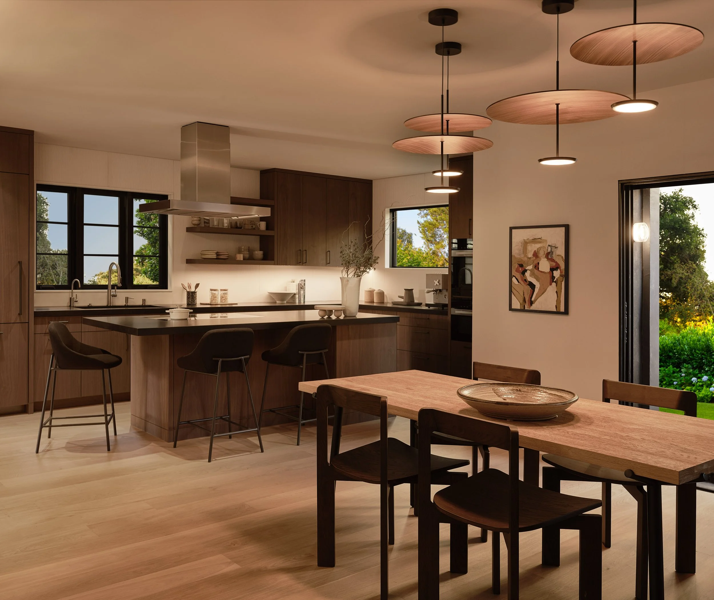 Open kitchen and dining area with custom wood cabinetry