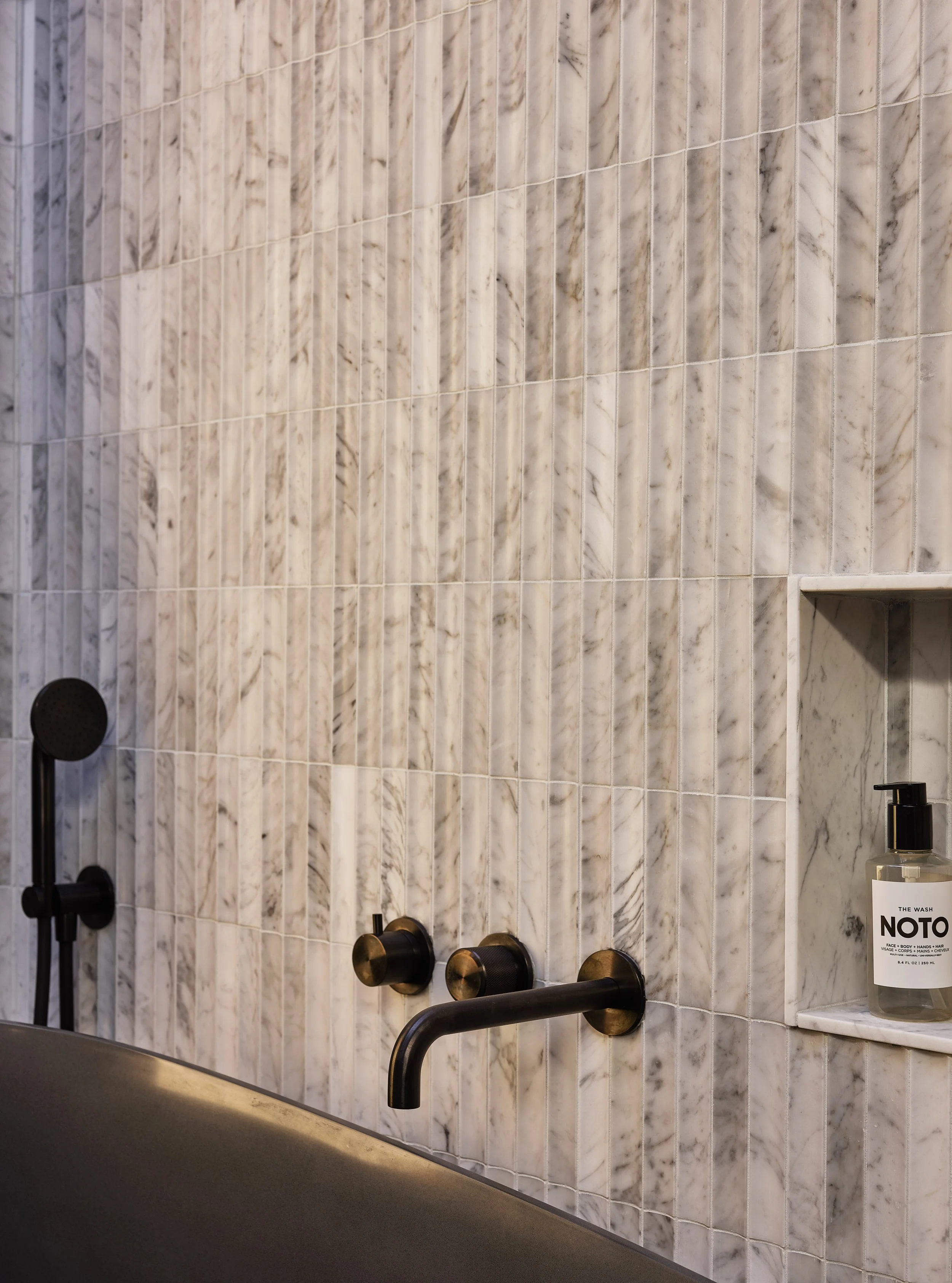 Detailed tilework inside the primary bathroom shower