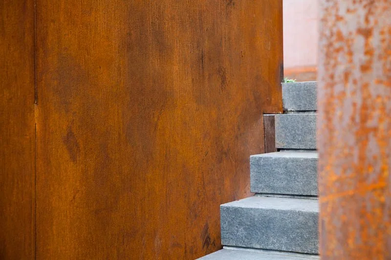 Patina steel and concrete stairs at a San Francisco residence