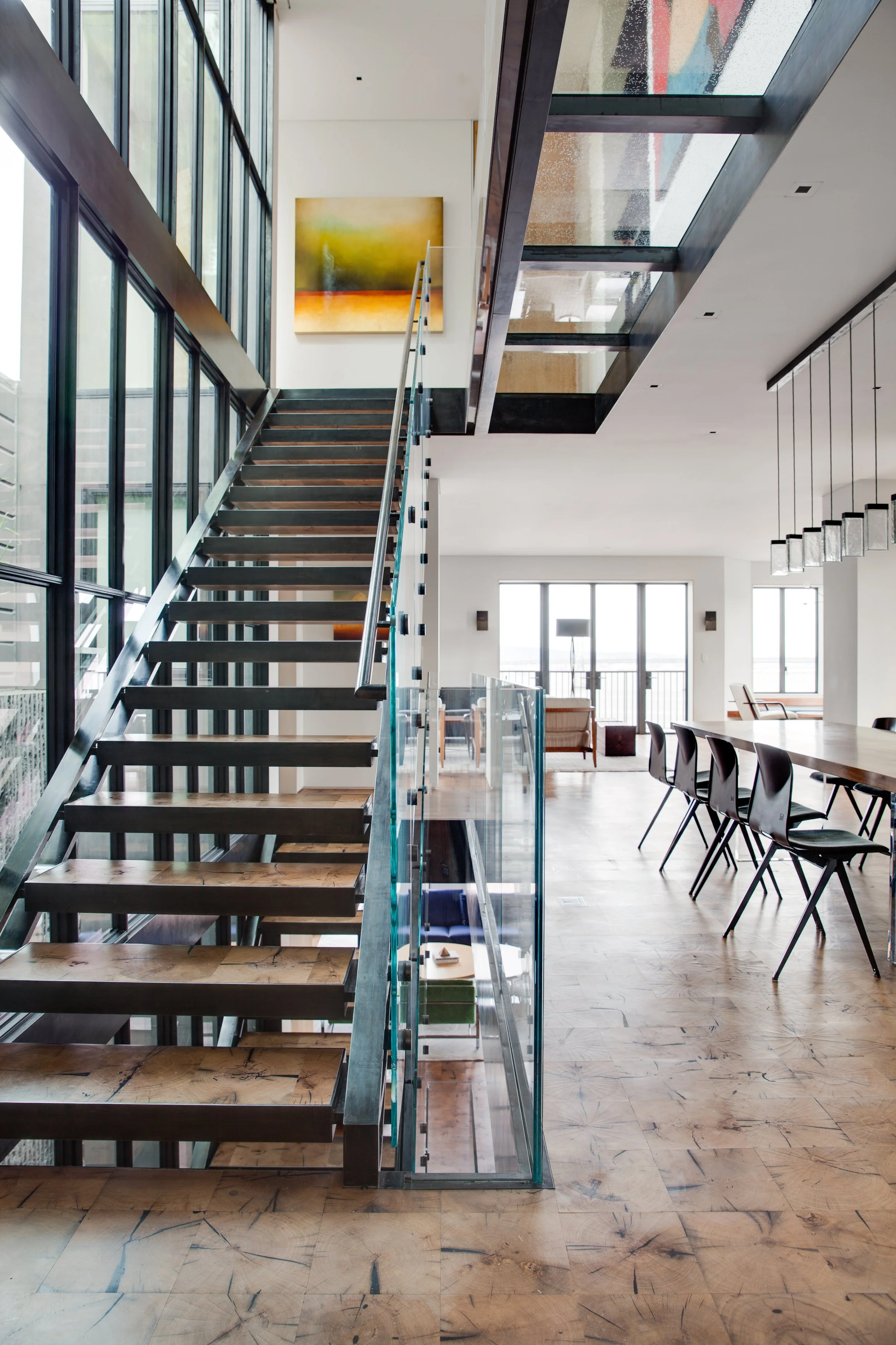 Reclaimed oak staircase with glass and steel structure in a San Francisco residence