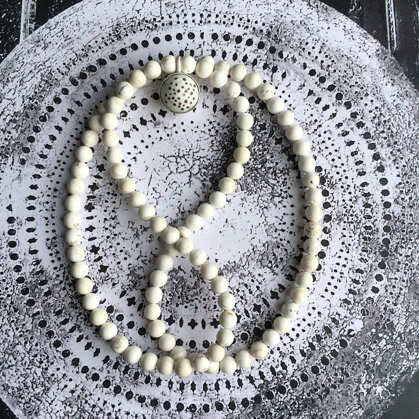 Alison Boyce Domed Enamel Necklace displayed on decorative background