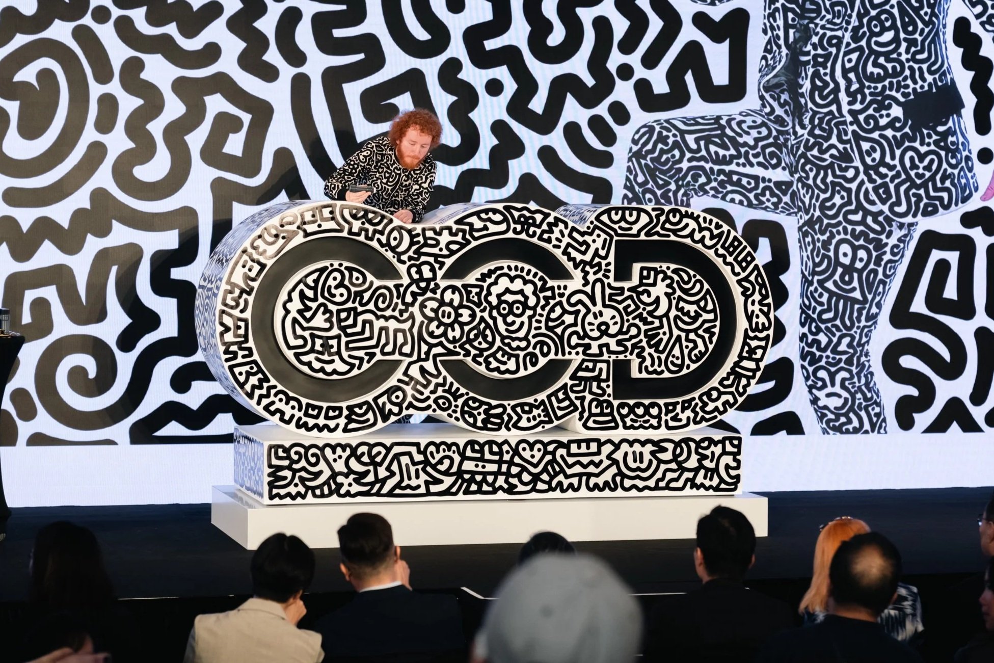 Close-up view of intricate linework forming the visual identity of the exhibition environment.