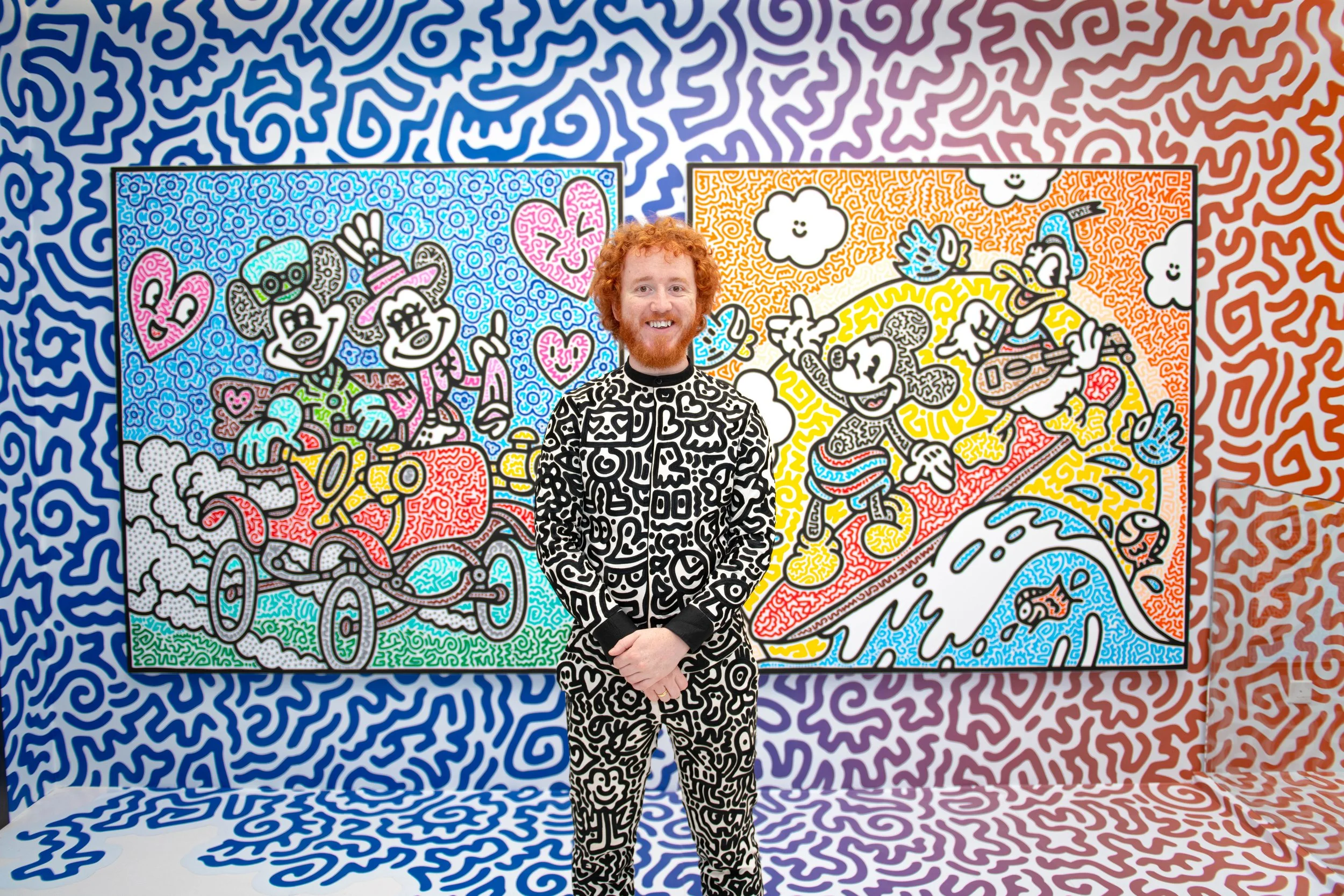 Mr Doodle standing within a fully illustrated environment, emphasizing the immersive nature of the exhibition space.
