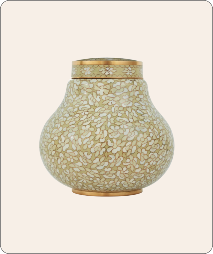 white and gold urn