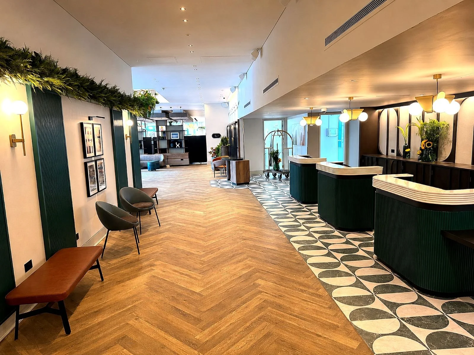 Crowne Plaza London Docklands refurb fit out Medlock Frb showing herringbone flooring and reception counters