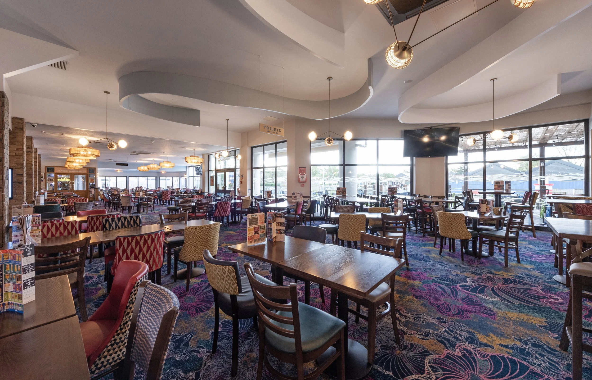 large seating area inside the alfred wainwright new JD wetherspoon pub at haven lakeland holiday park