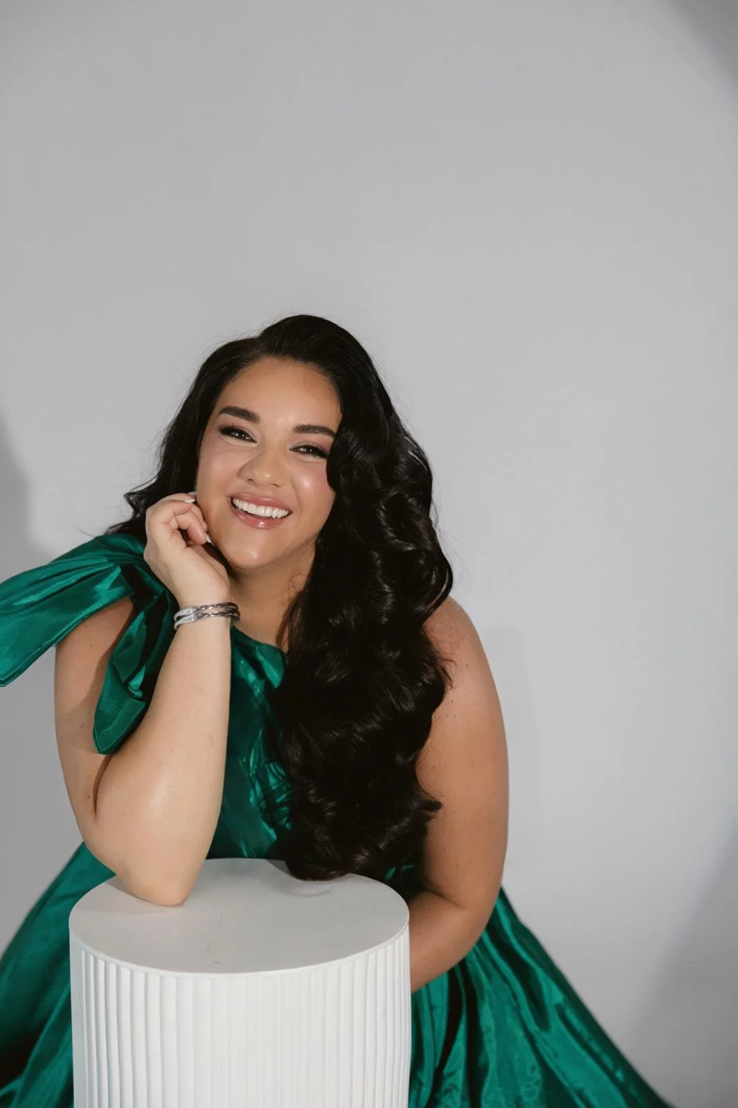 Jeanette Vecchione-Donatti smiling in an emerald gown
