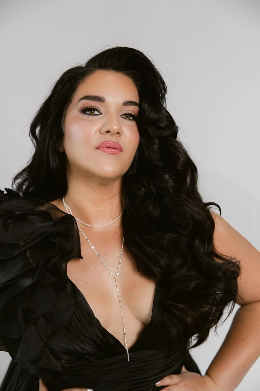 Close-up of Jeanette Vecchione-Donatti in a black ruffled gown with silver necklace