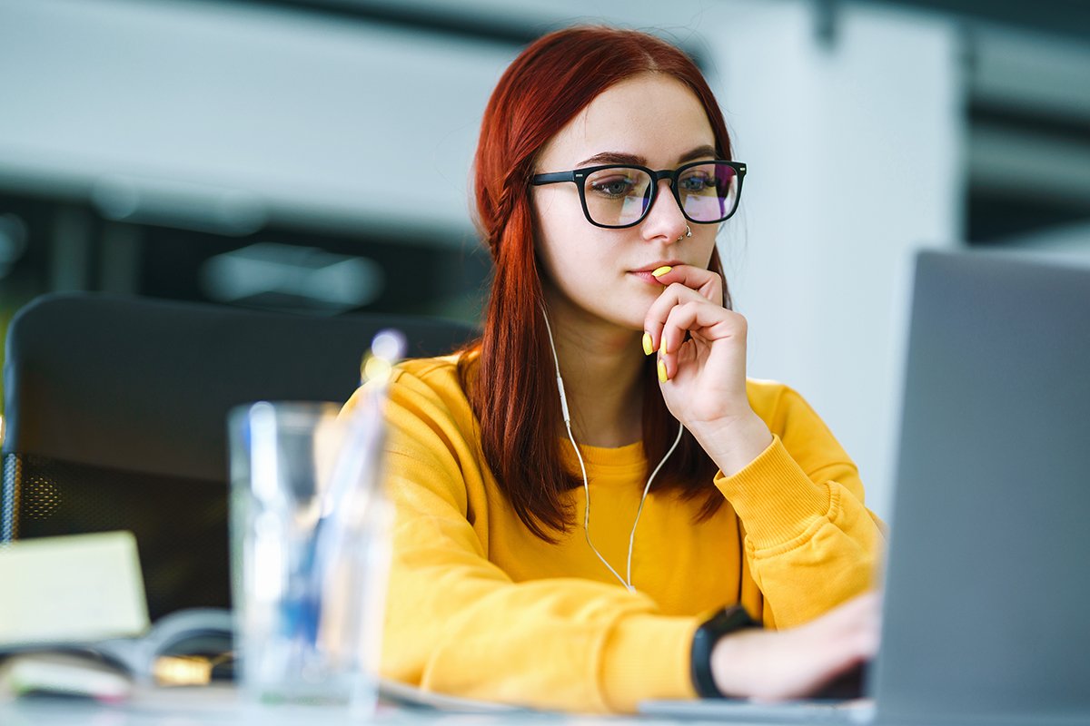 Student looking intently at a computer screen.