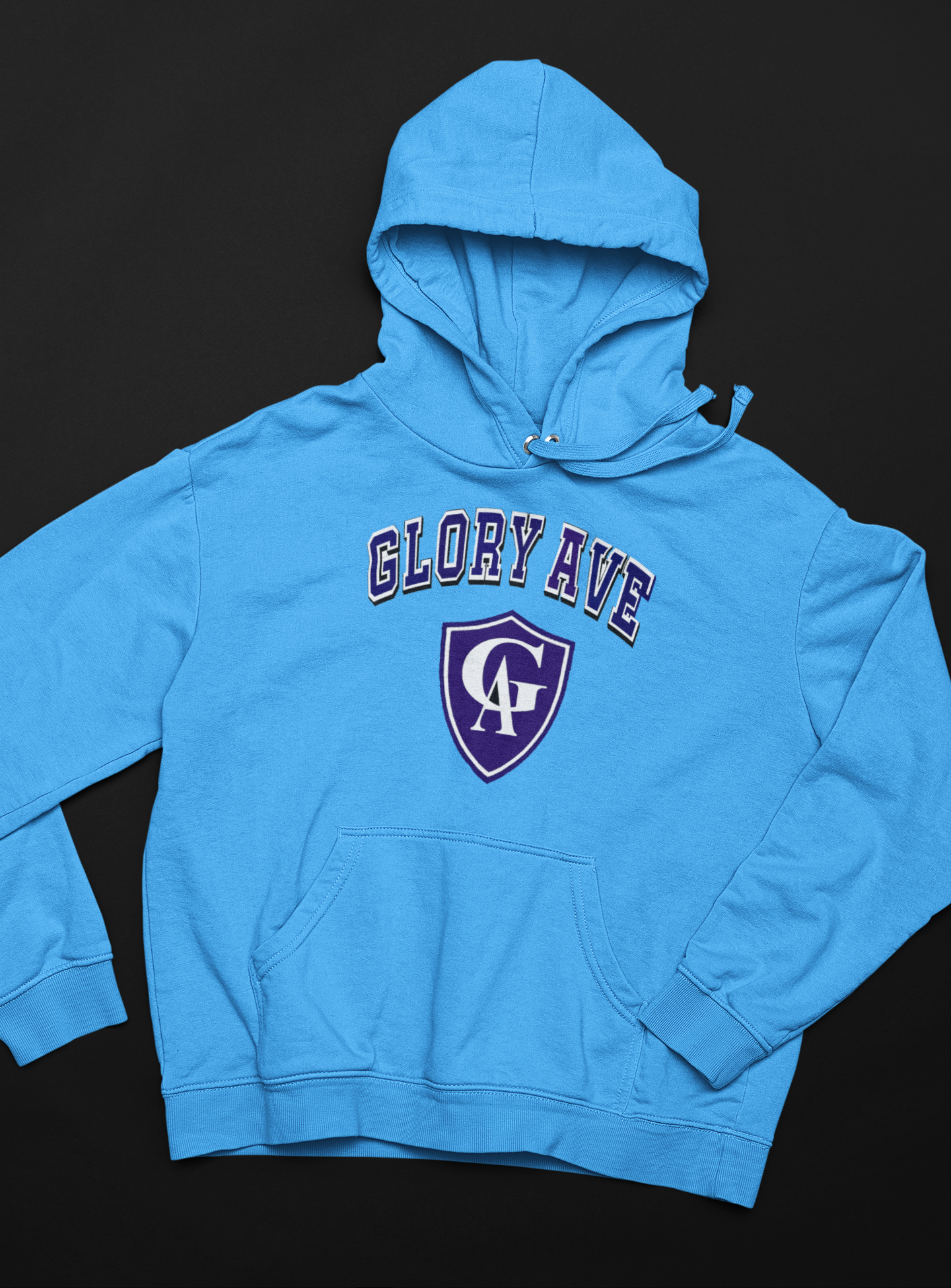 mockup-of-a-pullover-hoodie-lying-over-a-flat-surface-33901.png