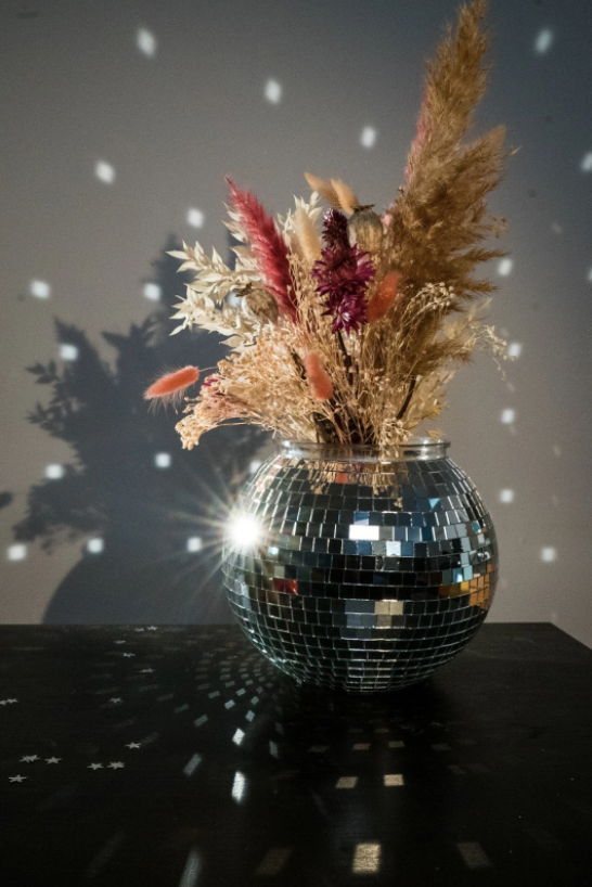 Disco ball centerpieces are likely coming to a wedding or event near you this summer!