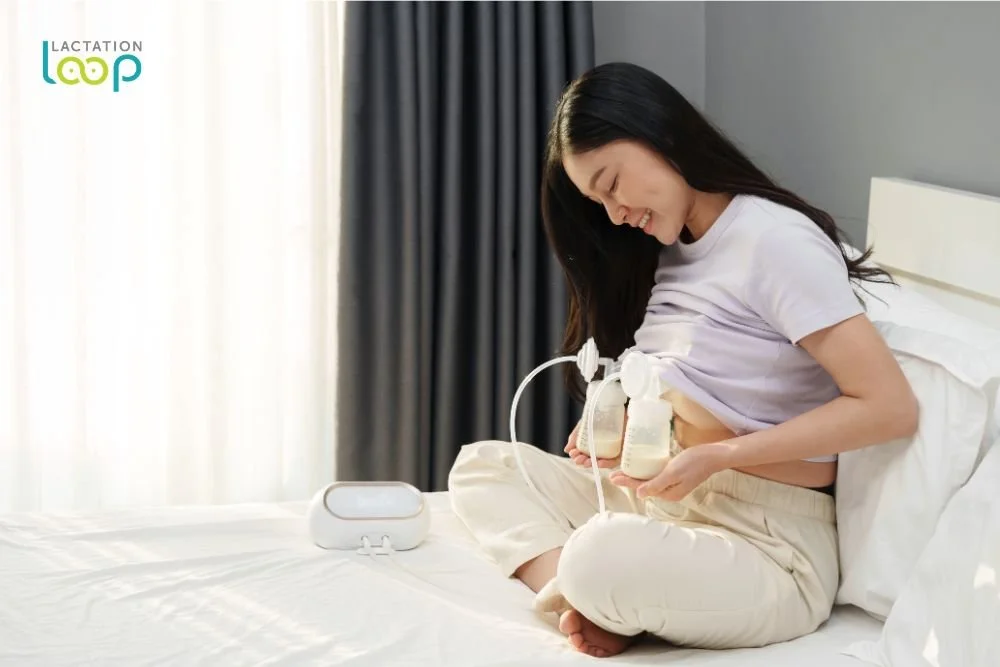 Mom using double electric breast pump with Lactation Loop IBCLC guidance