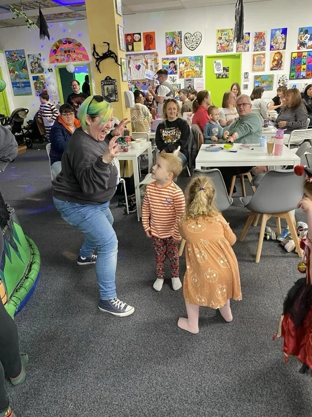 Families enjoying a themed community celebration