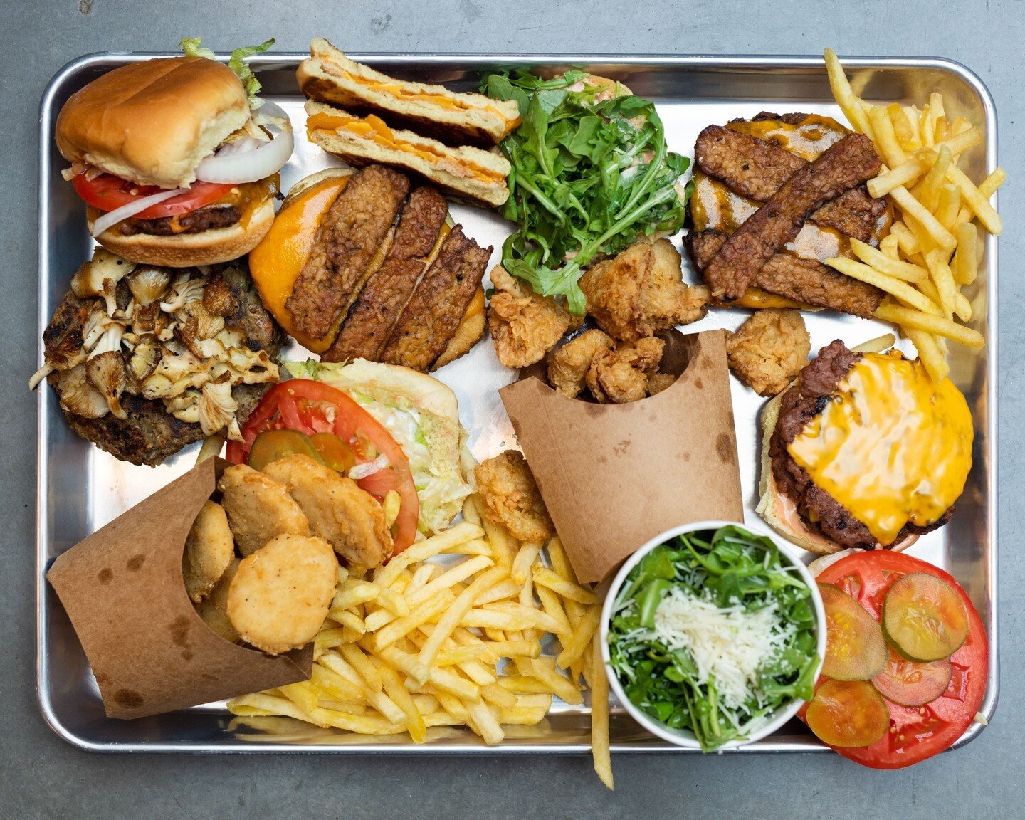 Everything you see on this tray is 💯 vegan, which is interesting because, for *harmless* food, it sure does slap hard!