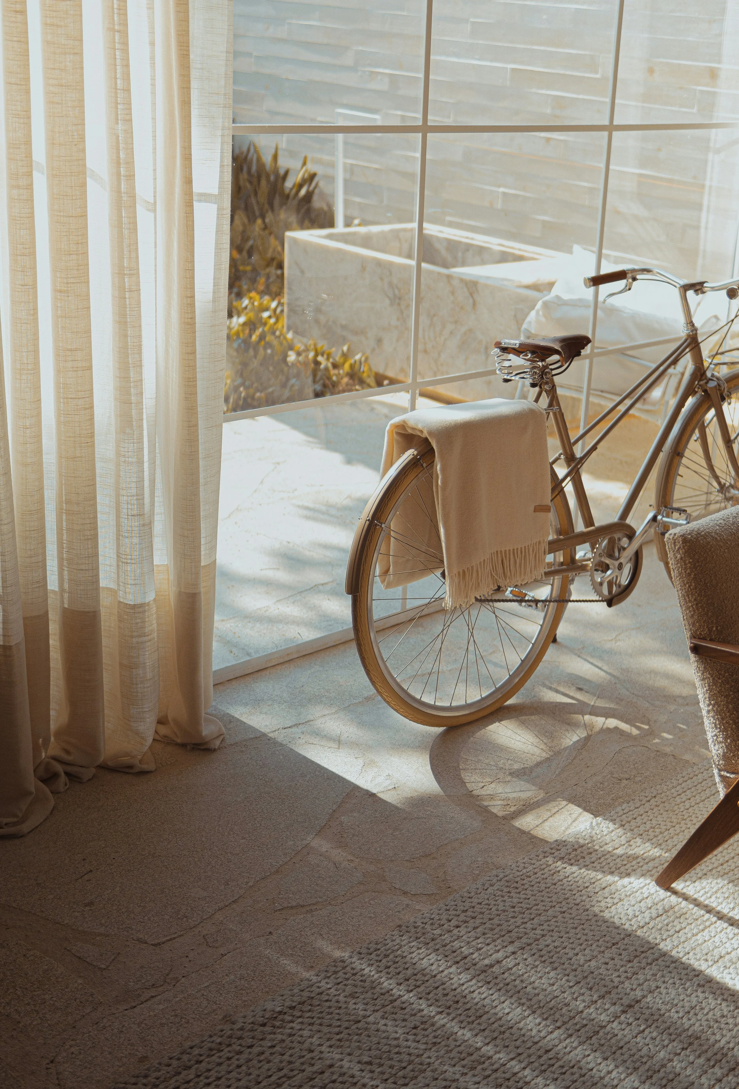 Aesthetic bicycle against window - boutique hotel - MADM Co