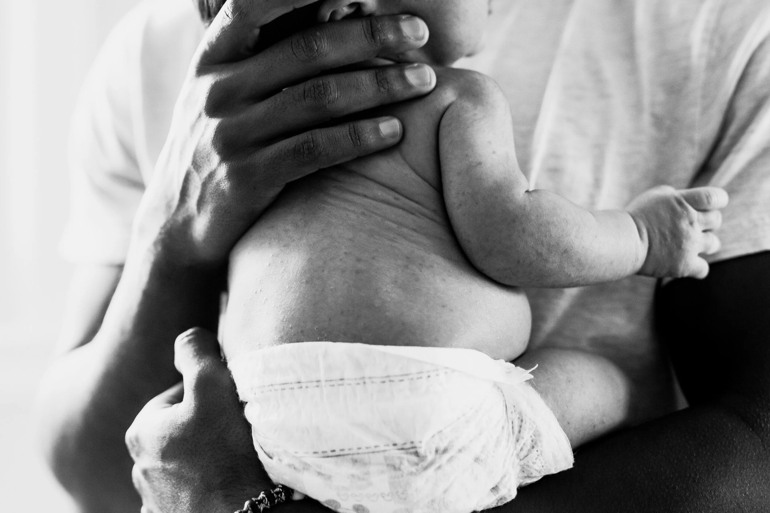 baby-in-diaper-dad-hands.jpg