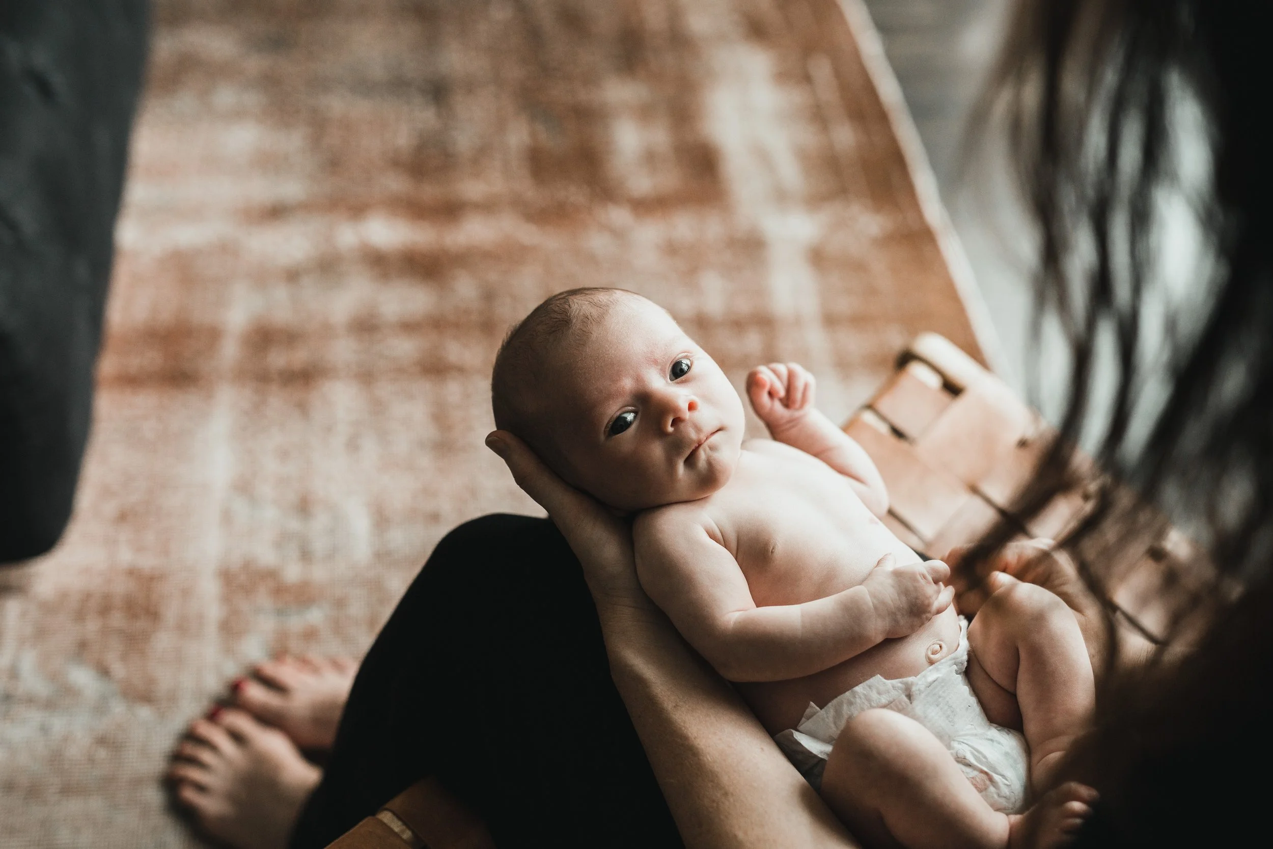 mom-cradling-baby-netherlands-home.jpg