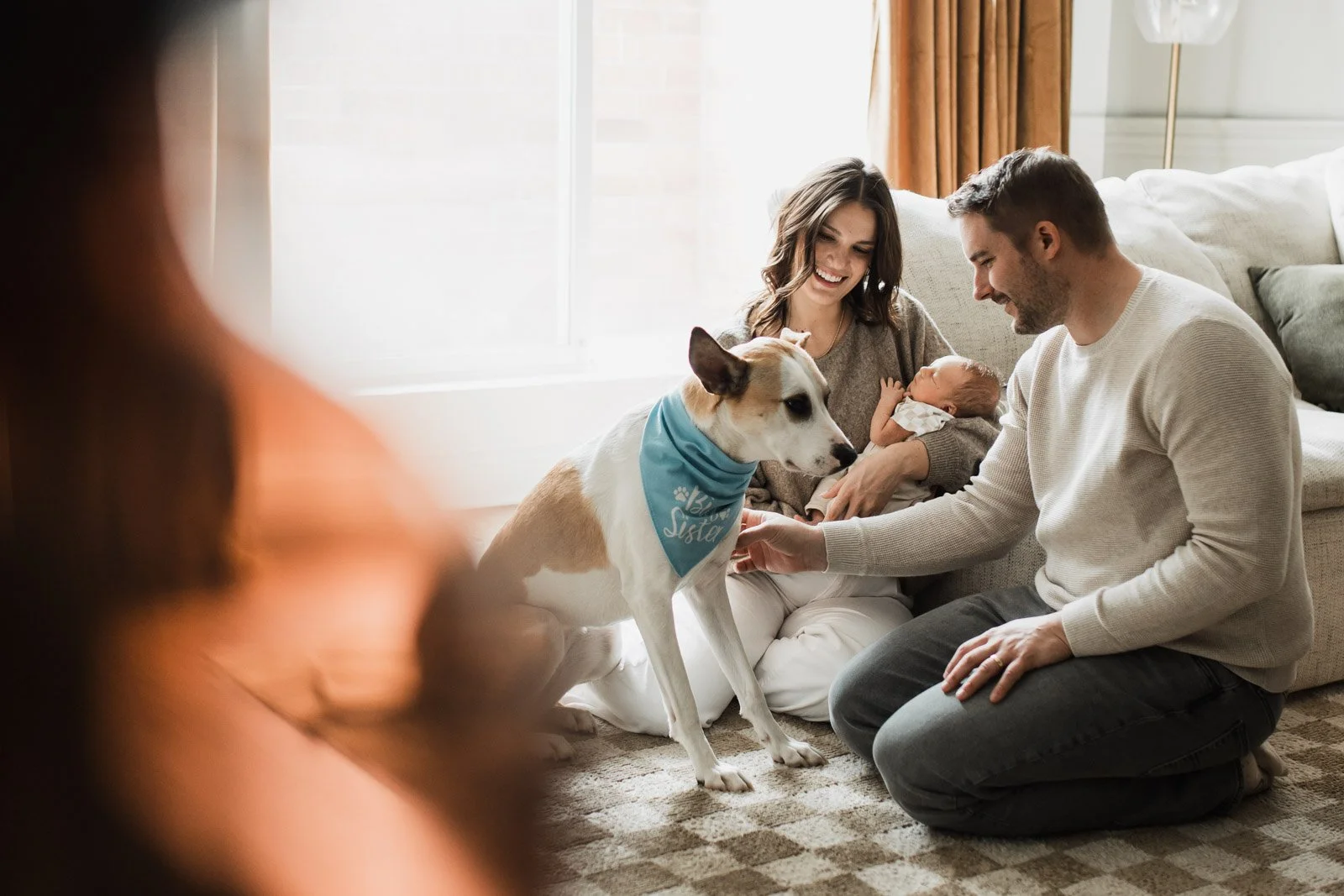 family with dog on floor