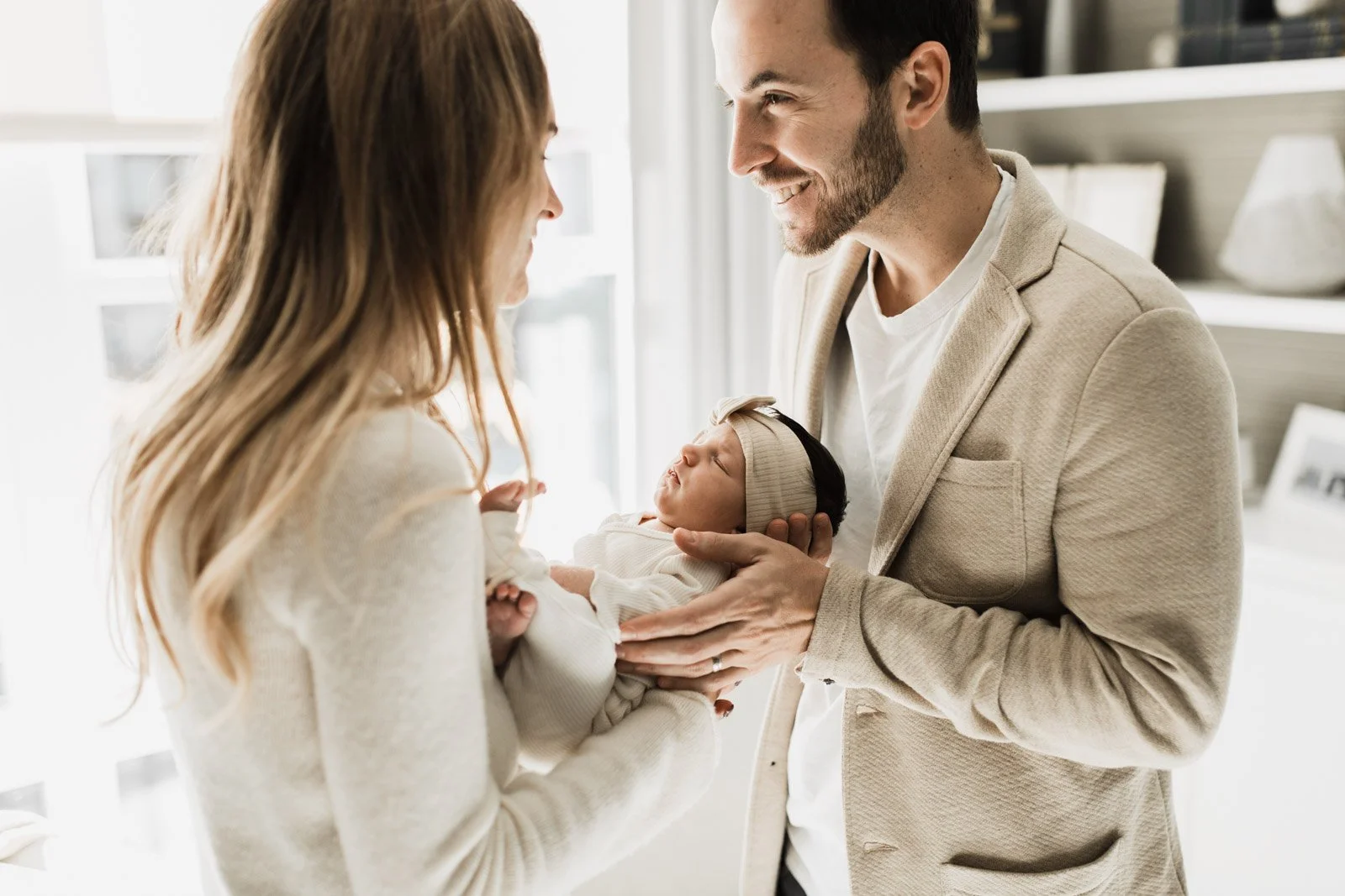 mom dad and new baby in amsterdam home