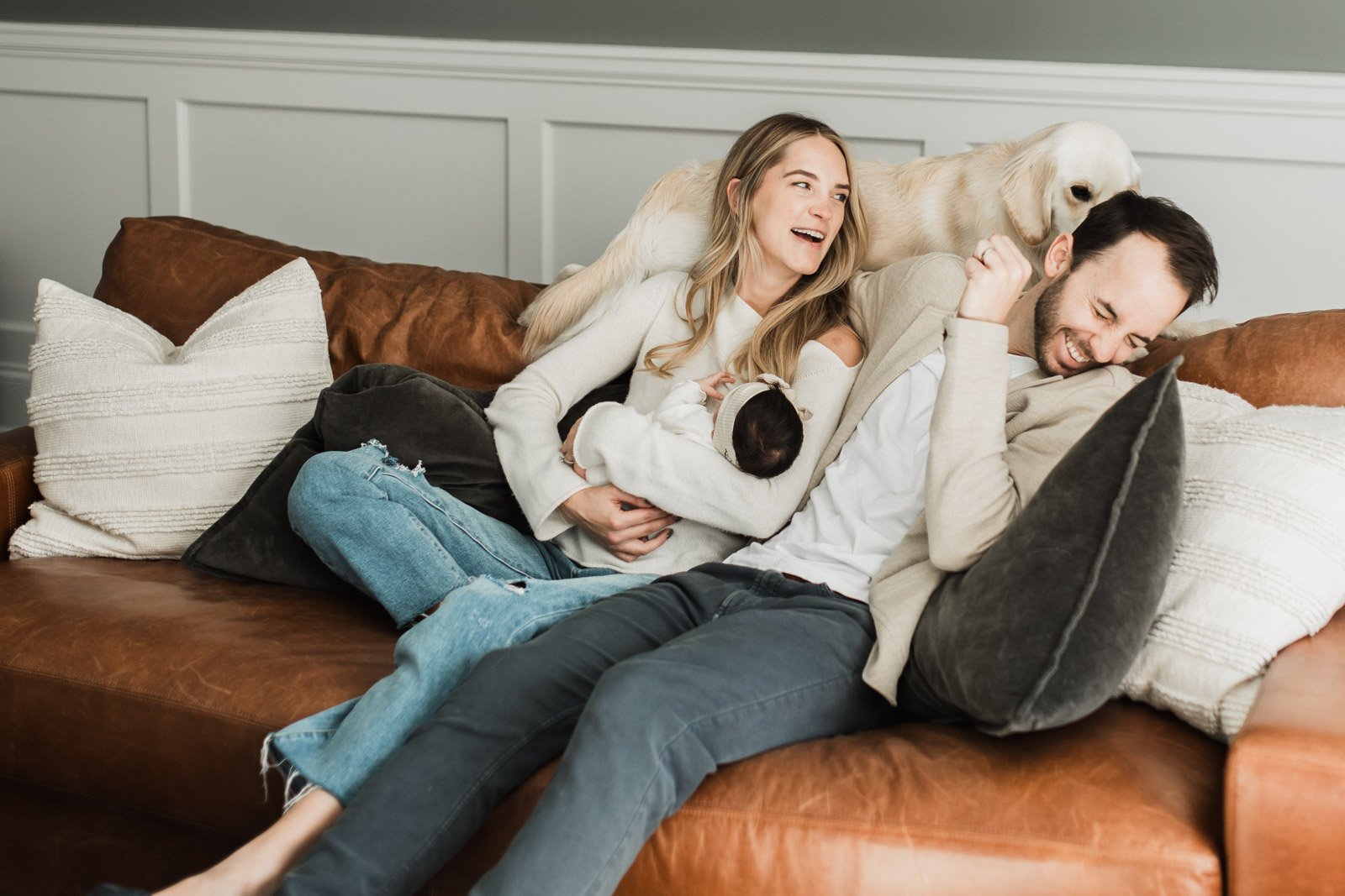 new family of three and dog licking dad