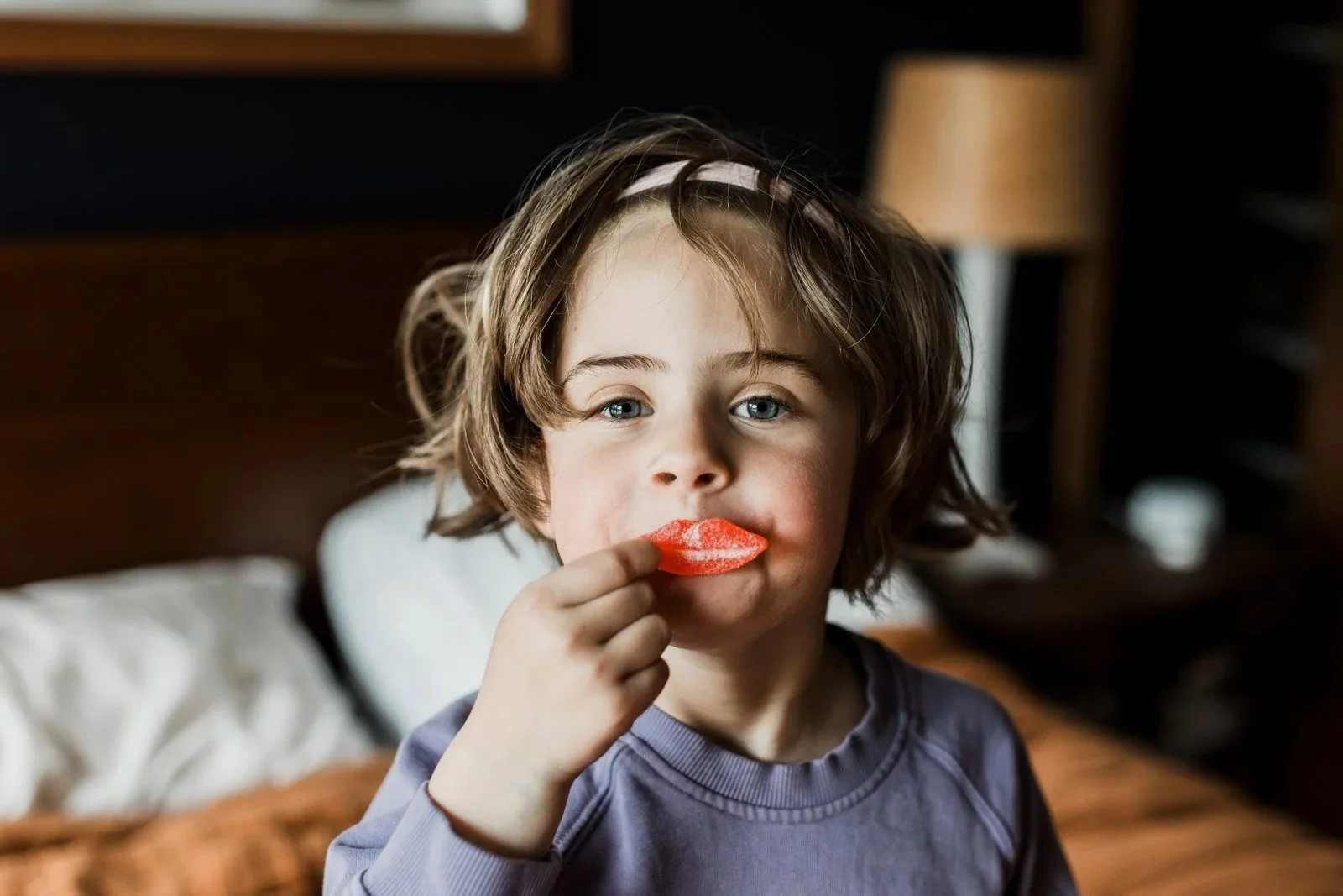 girl-holding-candy-lips-mouth.jpg