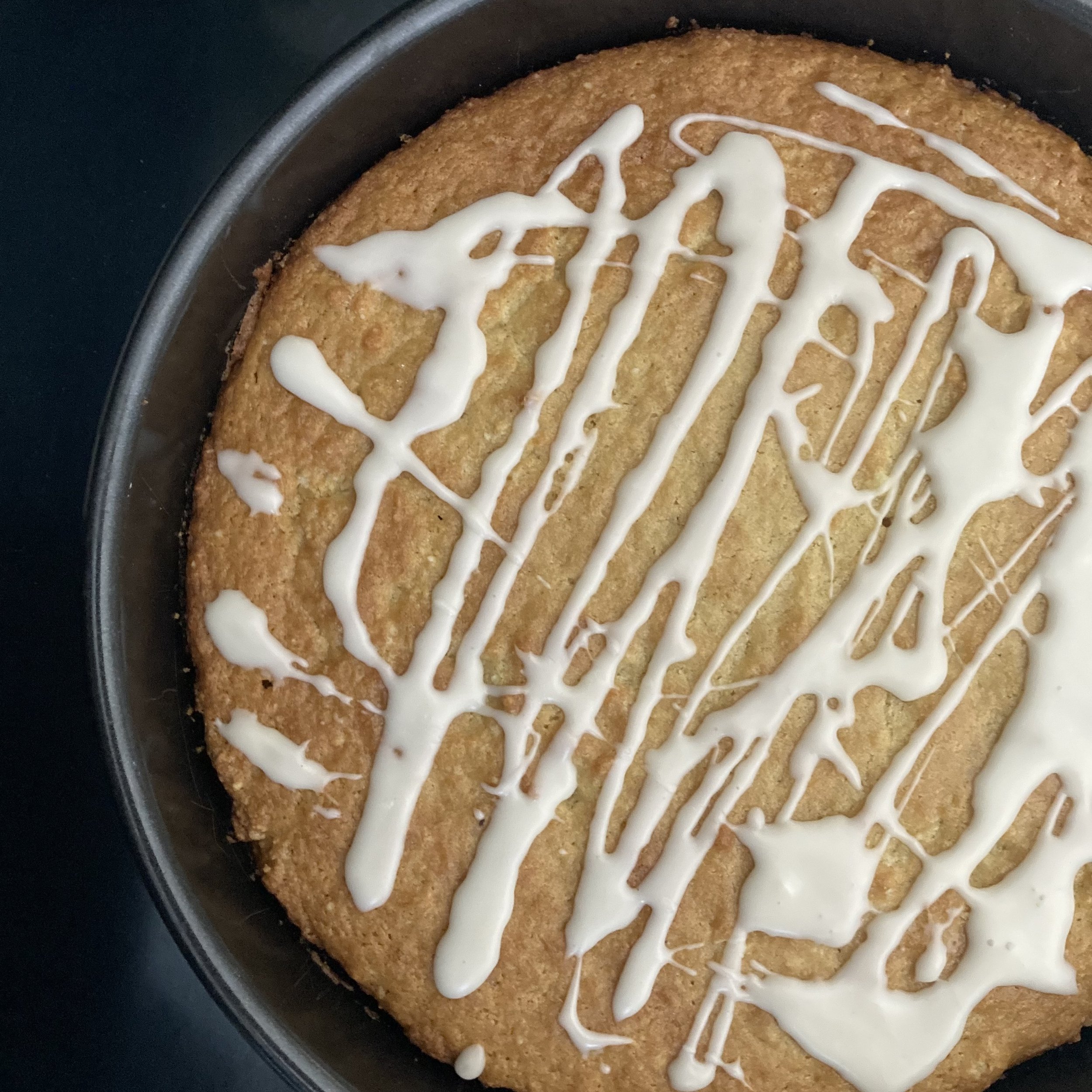 organic, vegan almond cake top view. whole cake catering