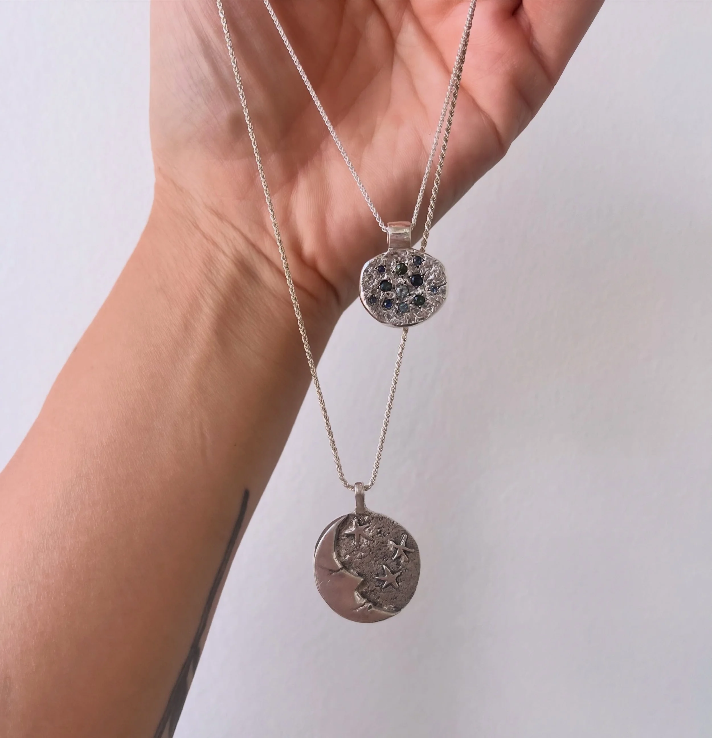 For your neck:
The Man in the Moon pendant, now $170+hst
Solid sterling with oxidized and textured moon&amp;stars details🌜✨
Hangs on a 24&rdquo; silver chain

The Bluebs pendant, now $320+hst
Faceted aquamarines, sapphires and tourmalines flush-set 