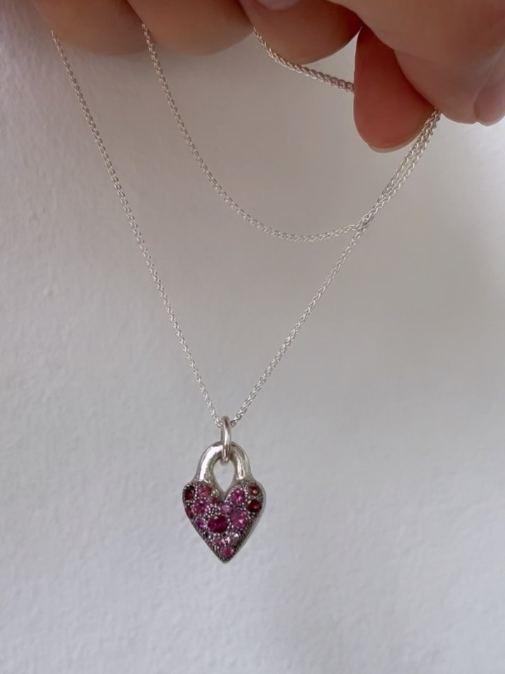 The pinky heart necklace - a puffy silver heart covered with pav&eacute; sapphires, amethysts and garnets in shades of pink and purple. The sweetest heart for your sweetest self💜🩷

Hangs on your choice of a 16&rdquo; or 18&rdquo; silver chain.

Par