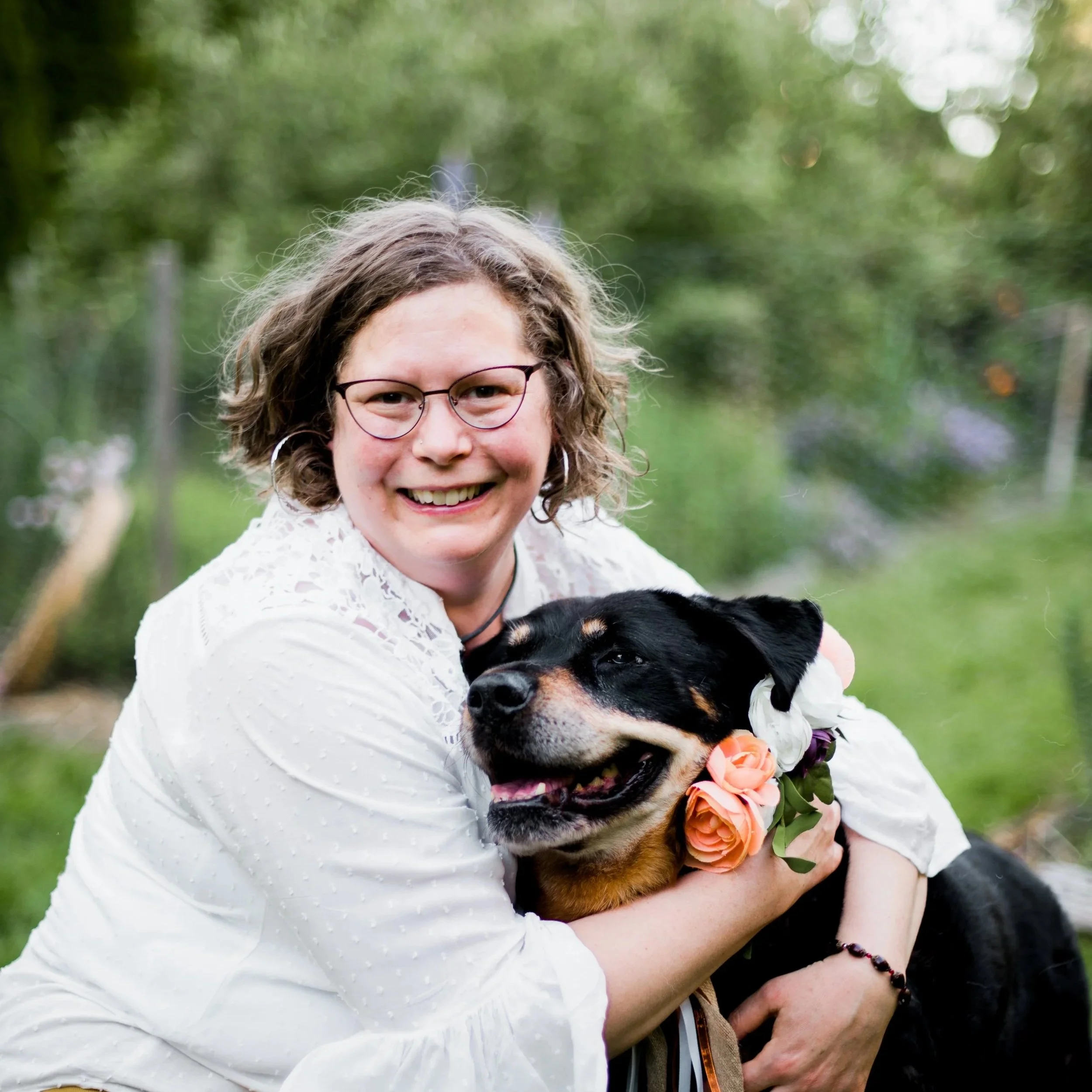 Pet medium, Joanna Schmidt, in the garden with her dog, Raspberry