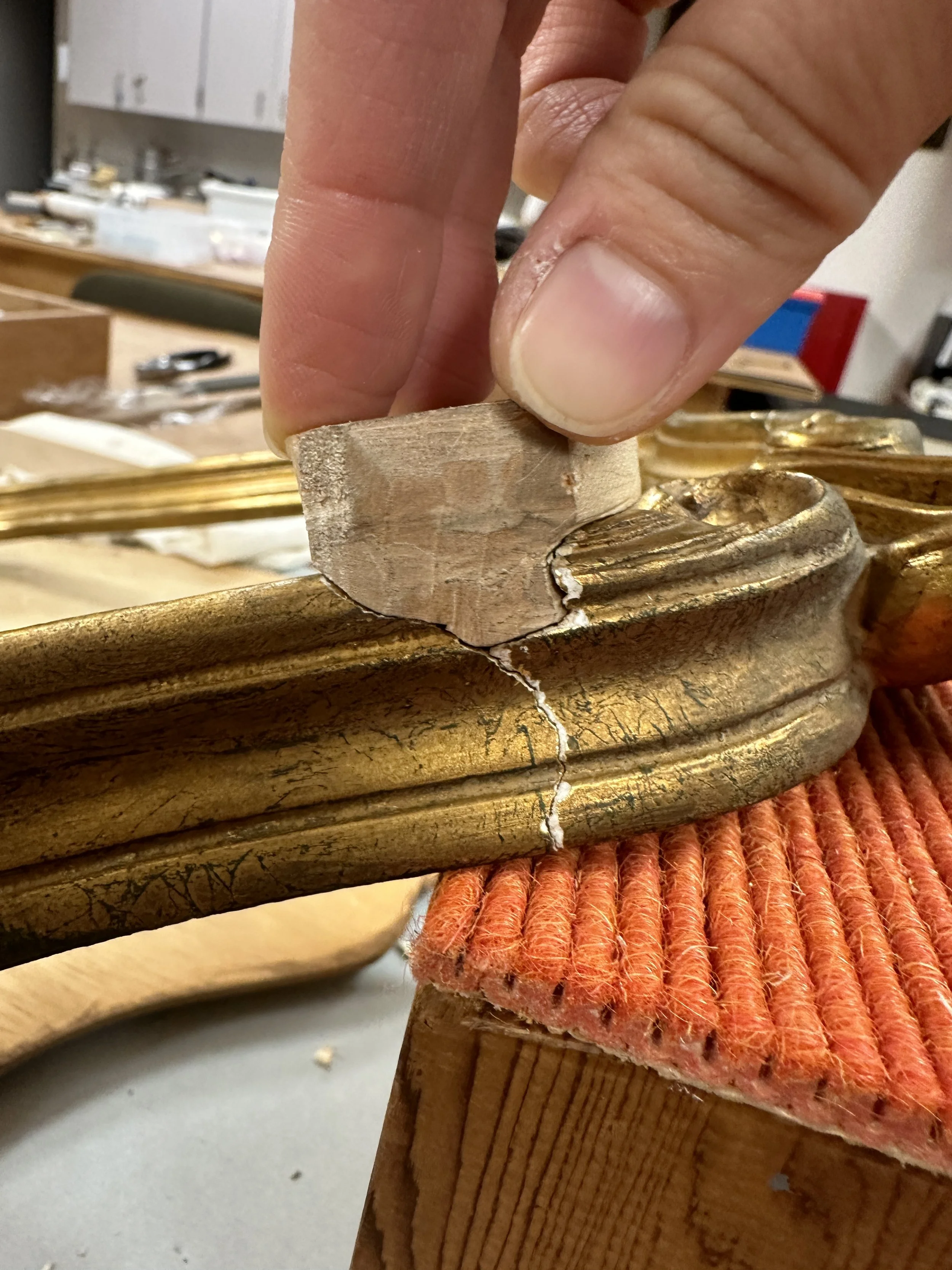 Testing the fit of the bass wood fill in the process of carving. (Photo: Jennifer Kim)