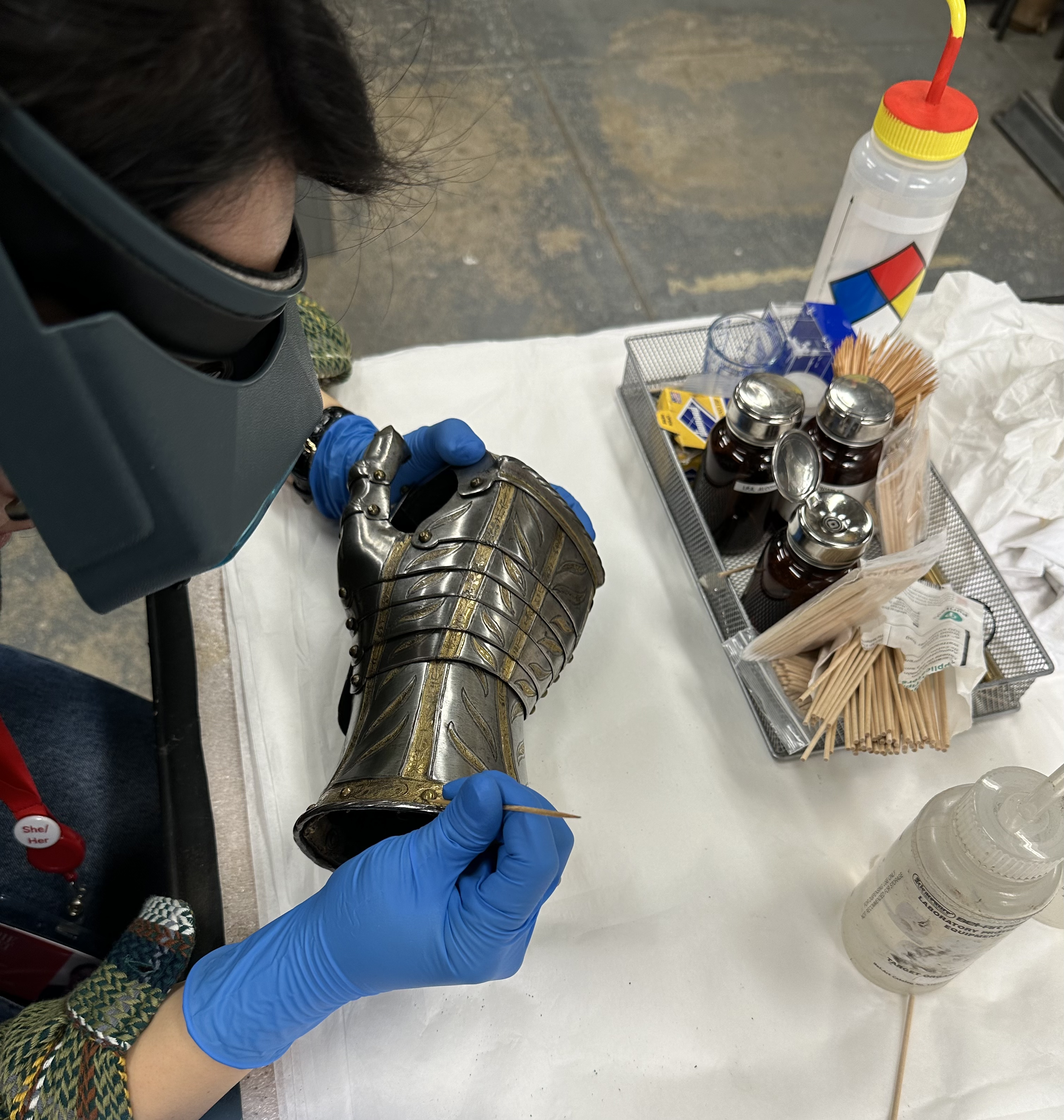 Removing grit from the side of a rivet head. (Photo: Sean Belair)