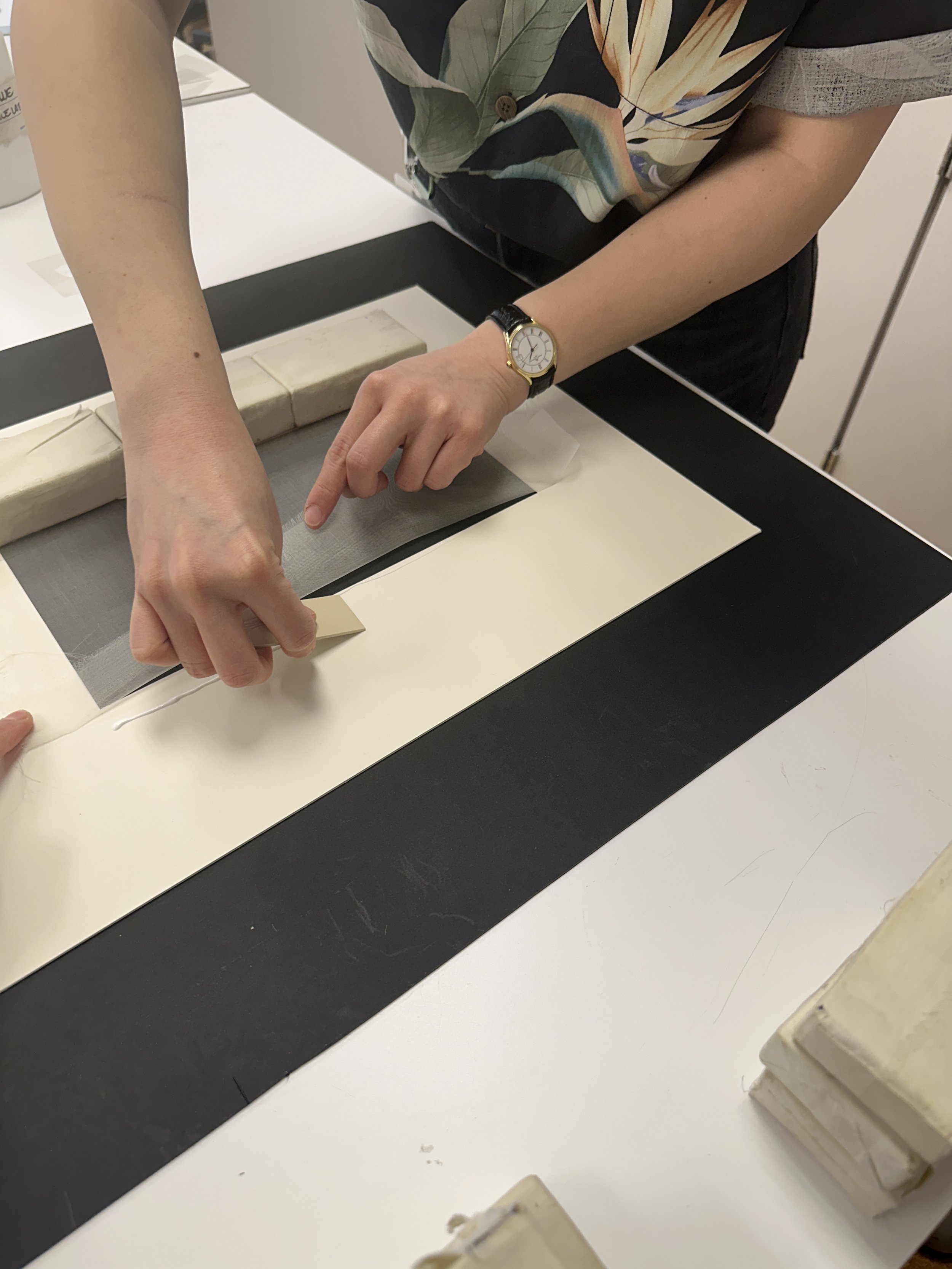 Smoothing down the PVA glue to a flat, even surface. (Photo: Carla Fontecchio)