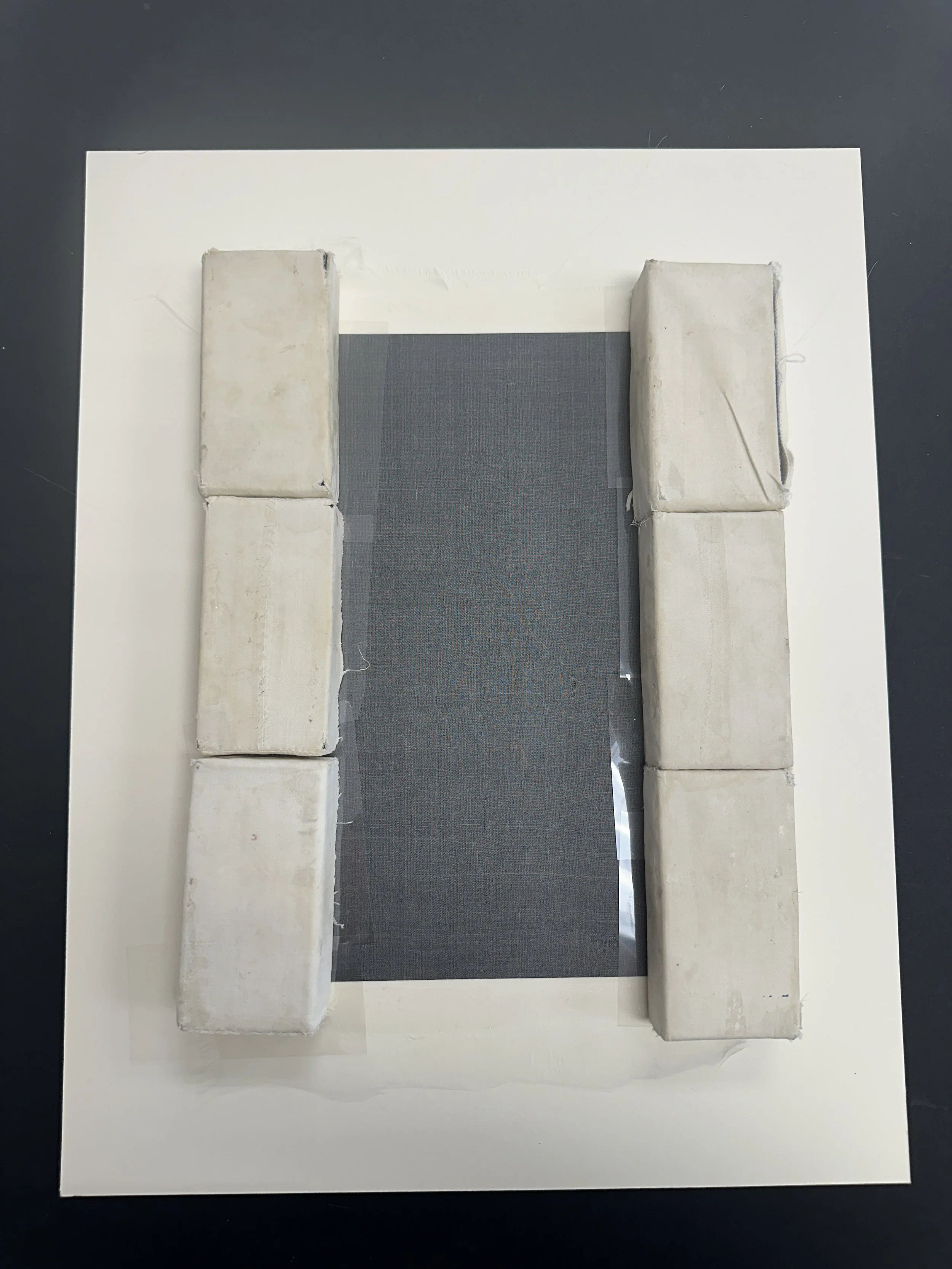 Drying under weights to hold the crepeline in place. (Photo: Jennifer Kim)