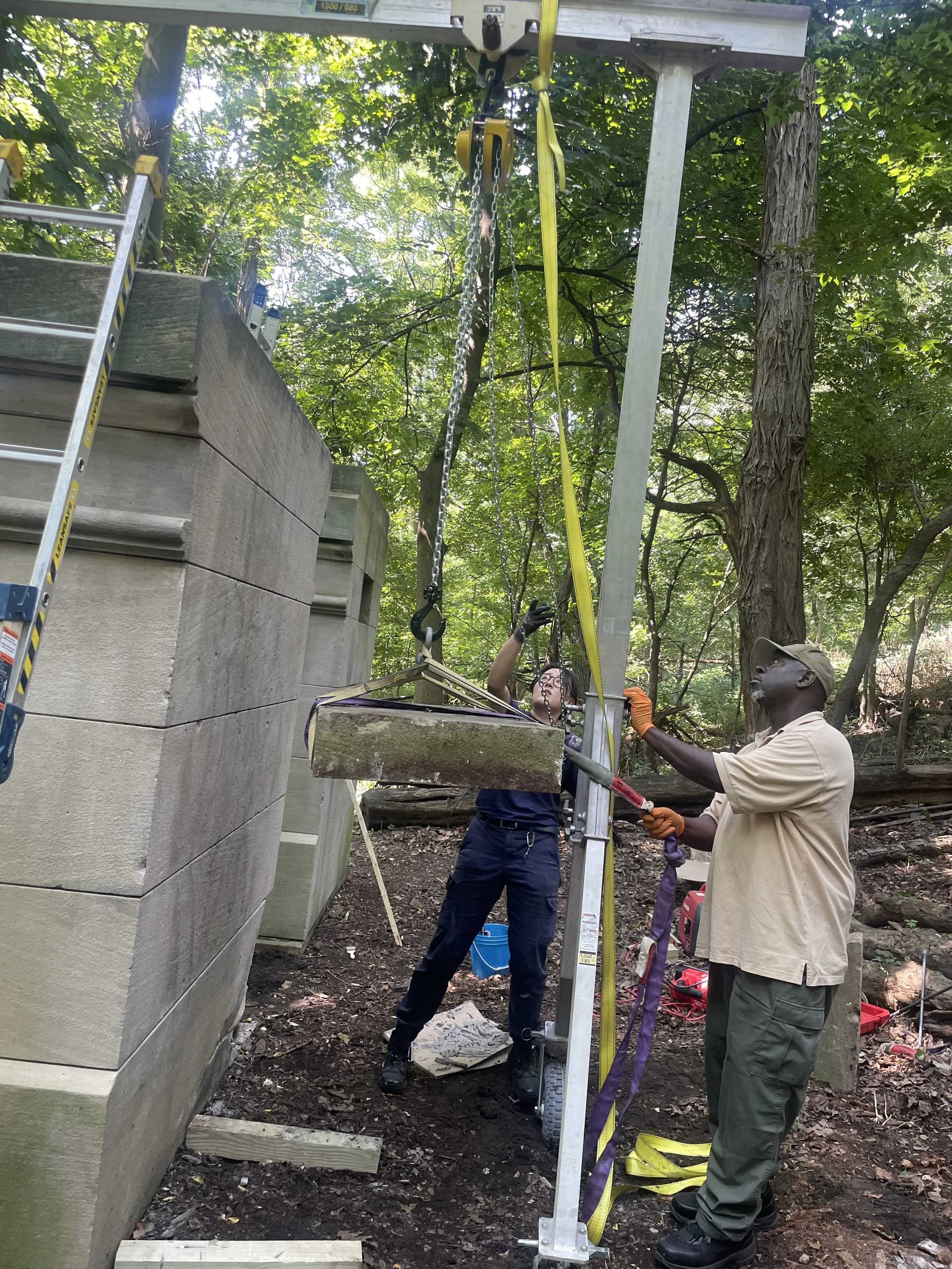 Hoisting up a capstone section with a gantry crane. (Photo: Aidan Thomas)