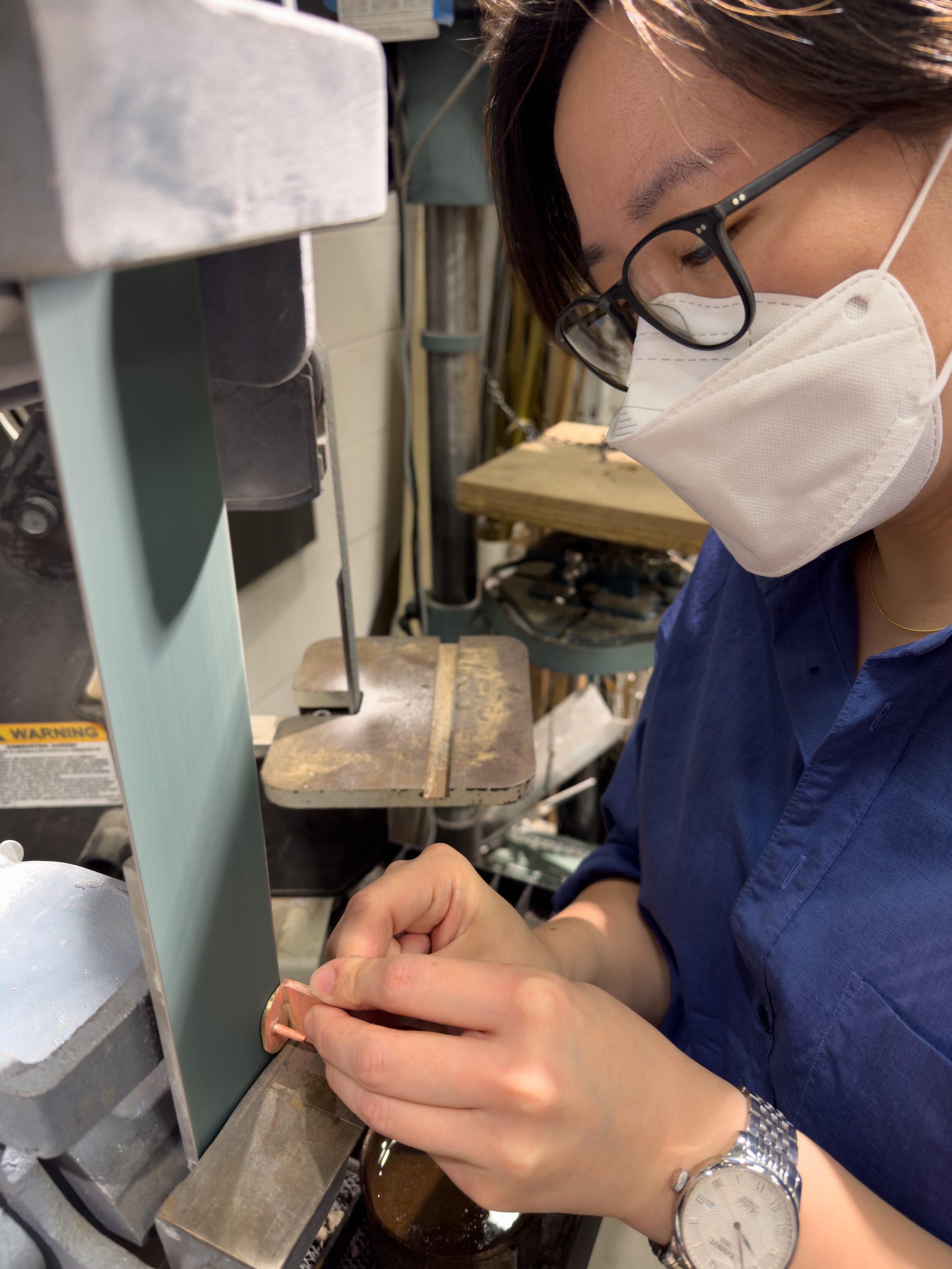 Fabricating the brass clip for the top of the cross. (Photo: Philip Brutz)