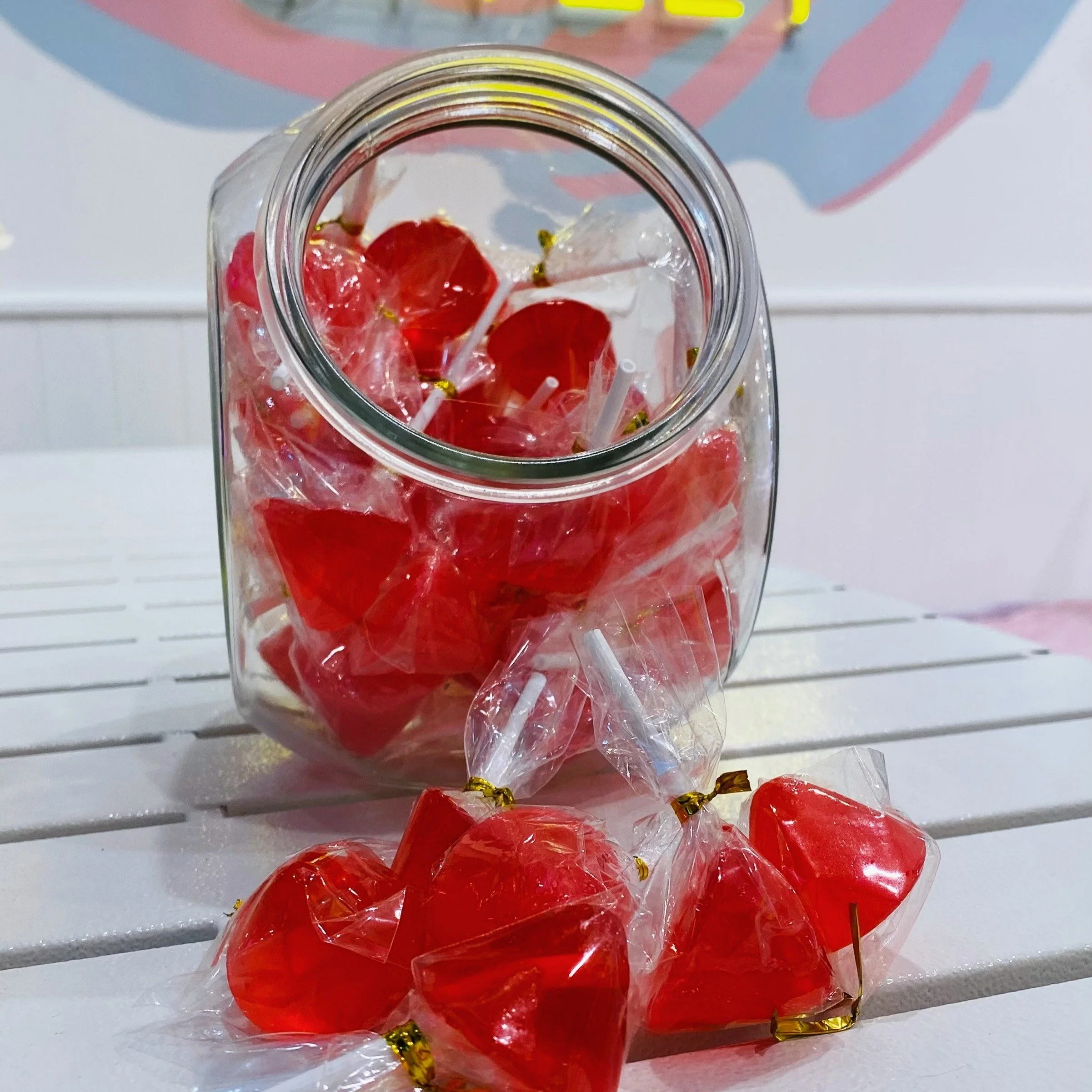 Umbrella lollipops are a novelty sweet that became popular in the late 20th century (1901-2000).

 These versions typically feature a clear or brightly colored hard candy shaped like a small umbrella, mounted on a stick with a decorative handle. They