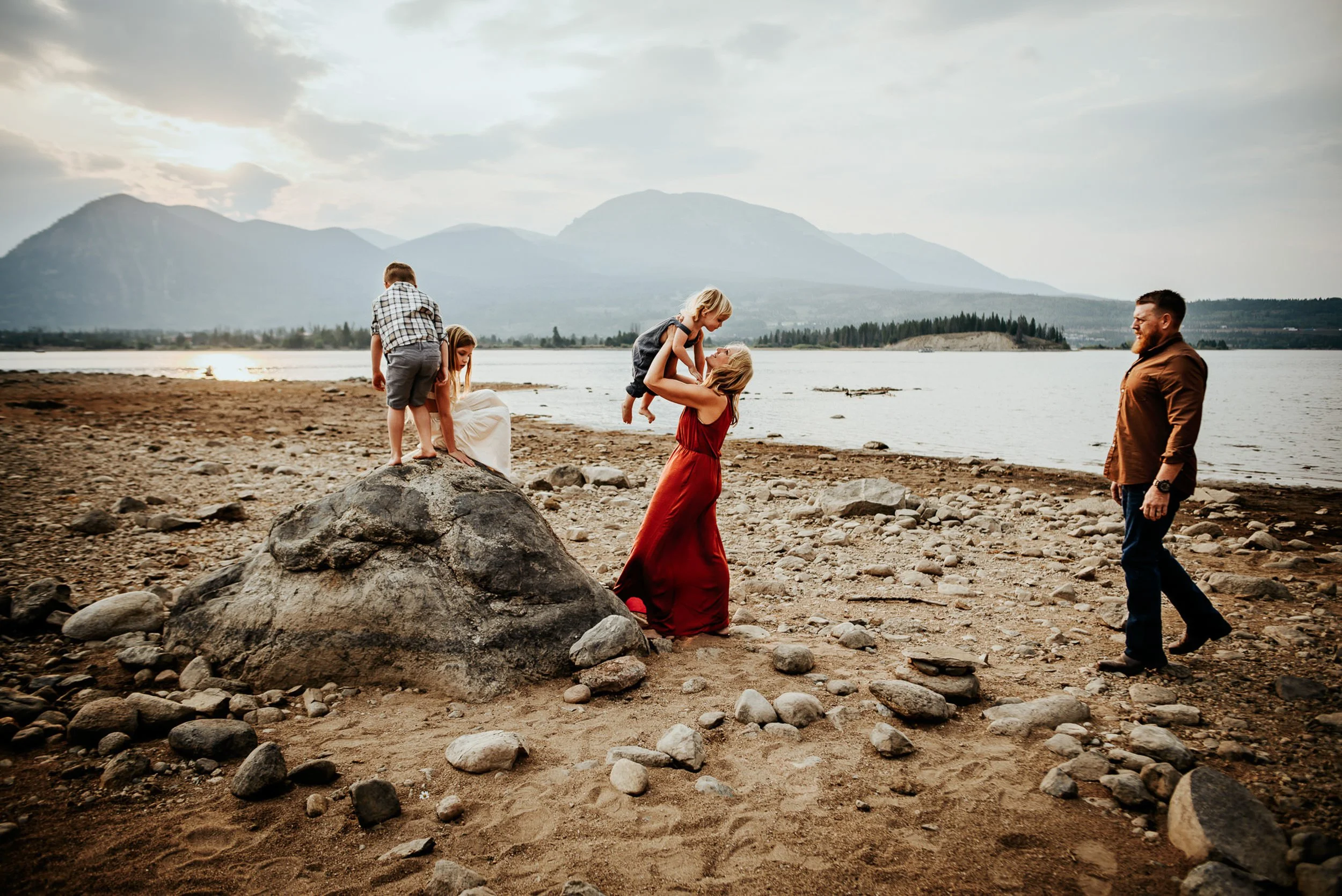 A family explores a lakeside together in Frisco, Colorado.