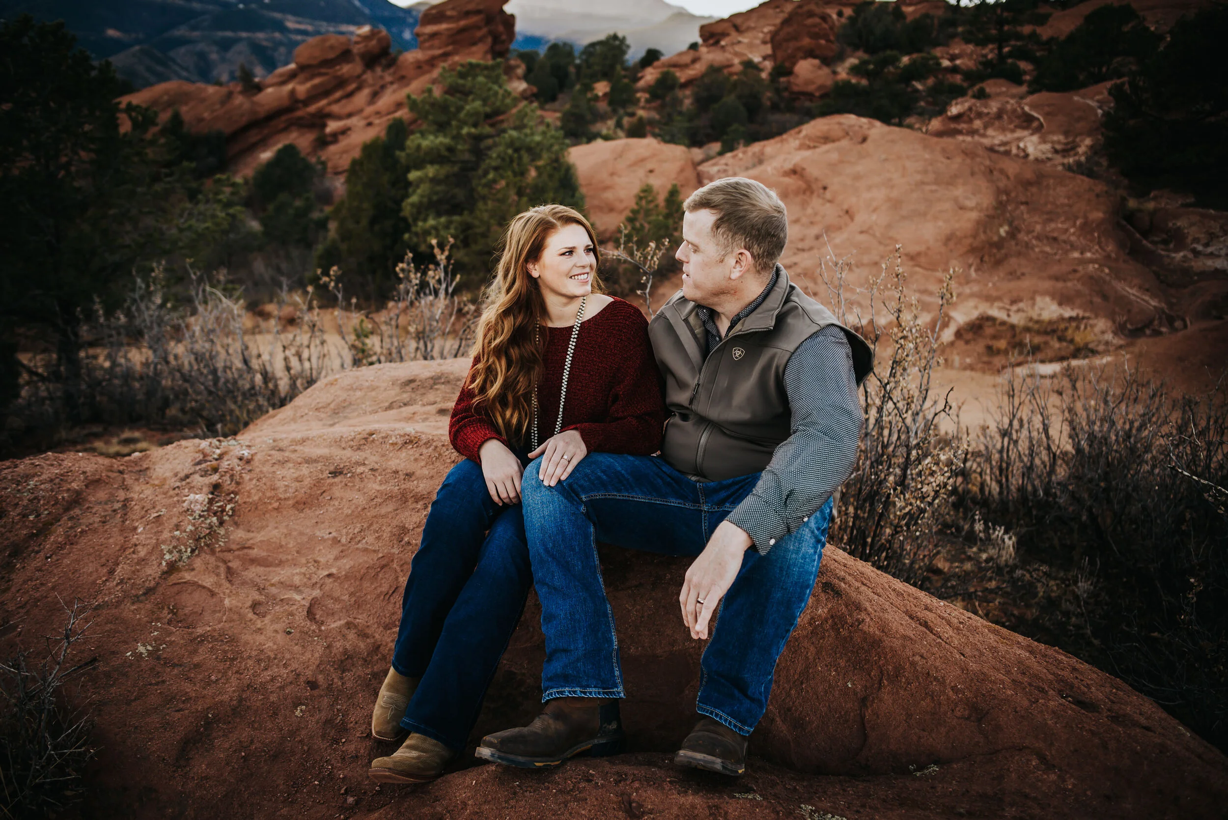 Couple laughing together during evening session.